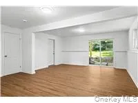Empty room featuring wood finished floors Empty room featuring wood finished floors