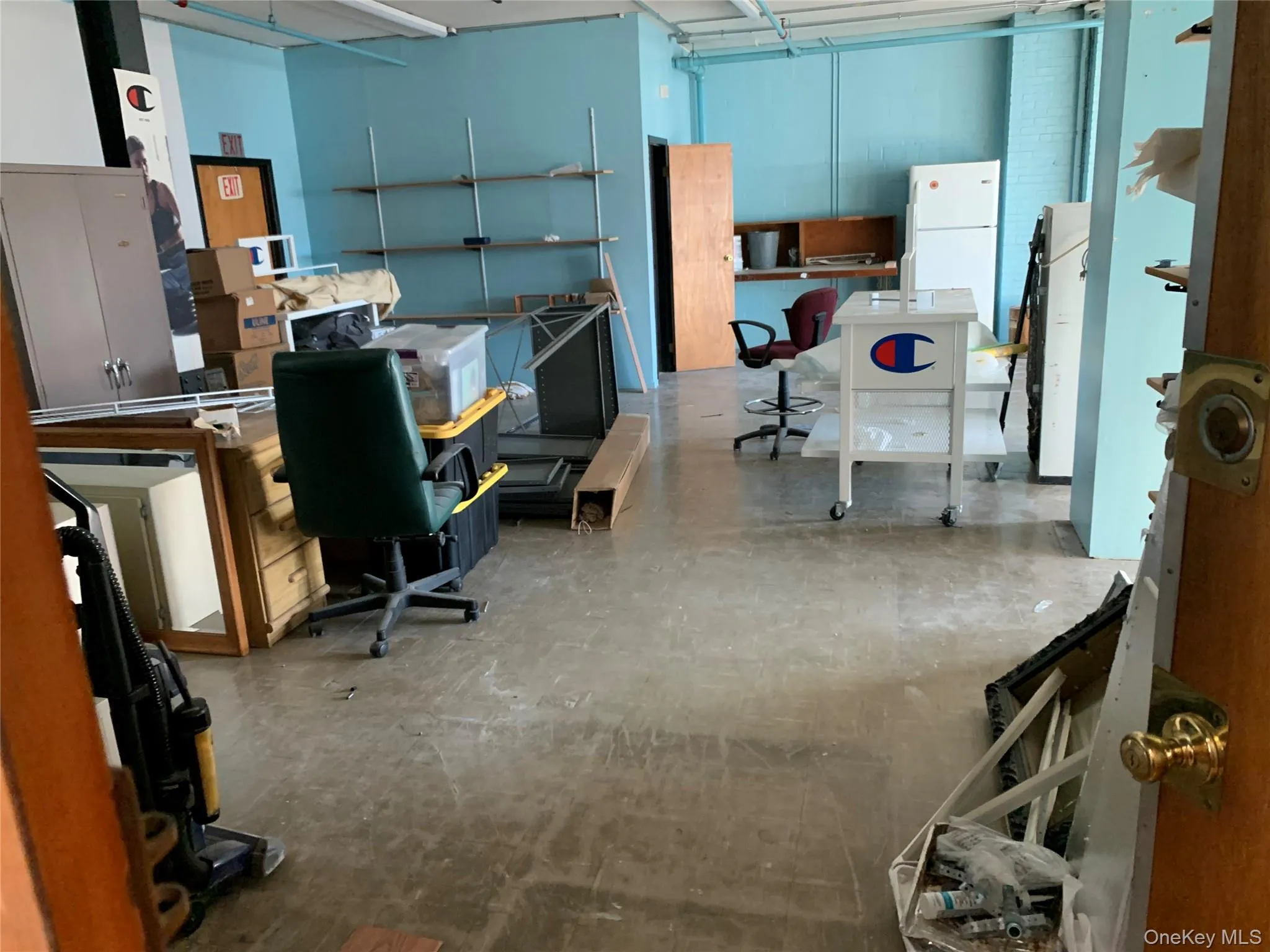 Office area featuring concrete flooring Office area featuring concrete flooring