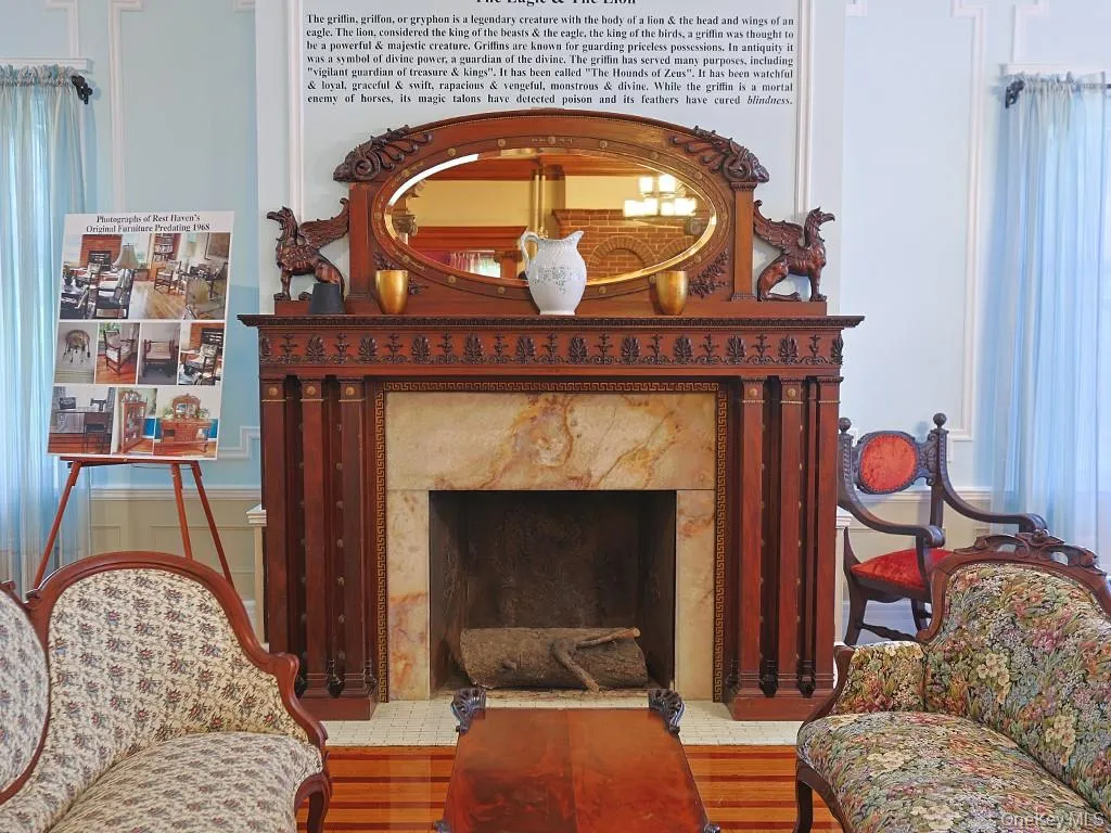 Sitting room featuring a premium fireplace and wood finished floors Sitting room featuring a premium fireplace and wood finished floors