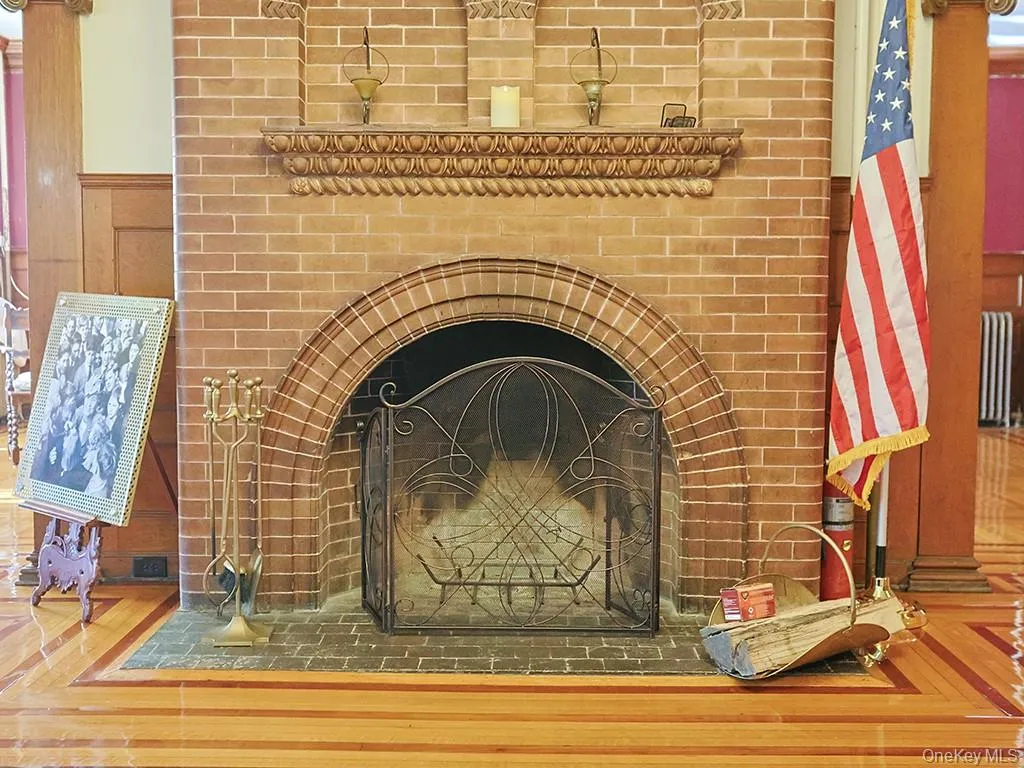 Detailed view of radiator and wood finished floors Detailed view of radiator and wood finished floors