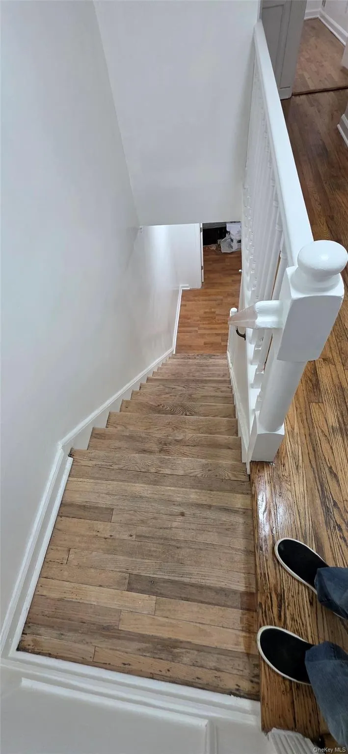 Stairs with wood-type flooring and baseboards Stairs with wood-type flooring and baseboards