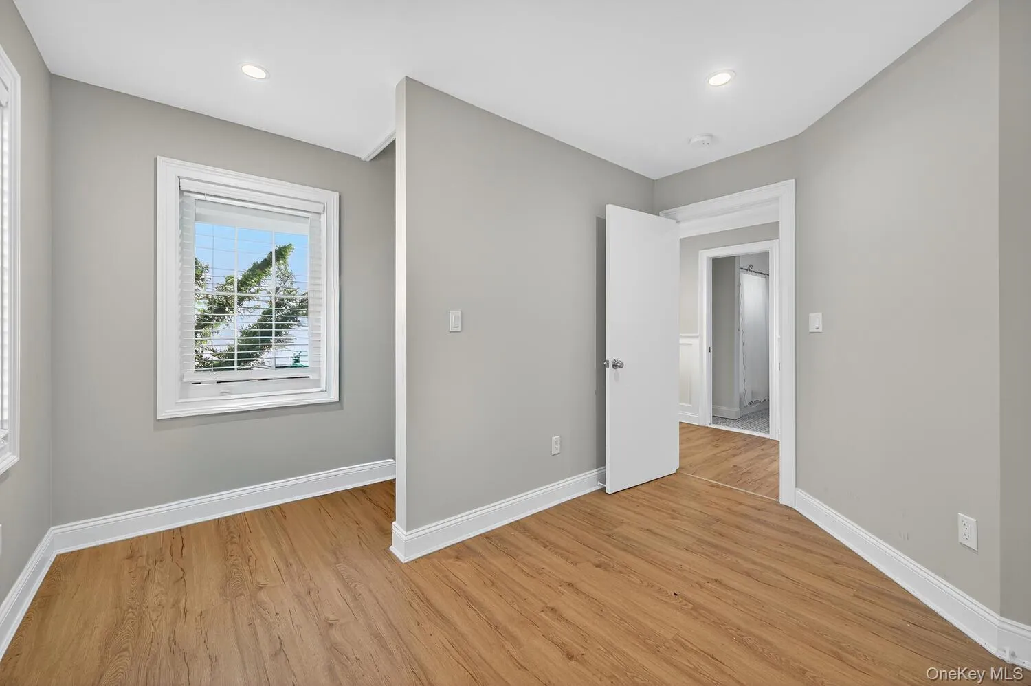 Unfurnished bedroom featuring light wood-type flooring and recessed lighting Unfurnished bedroom featuring light wood-type flooring and recessed lighting
