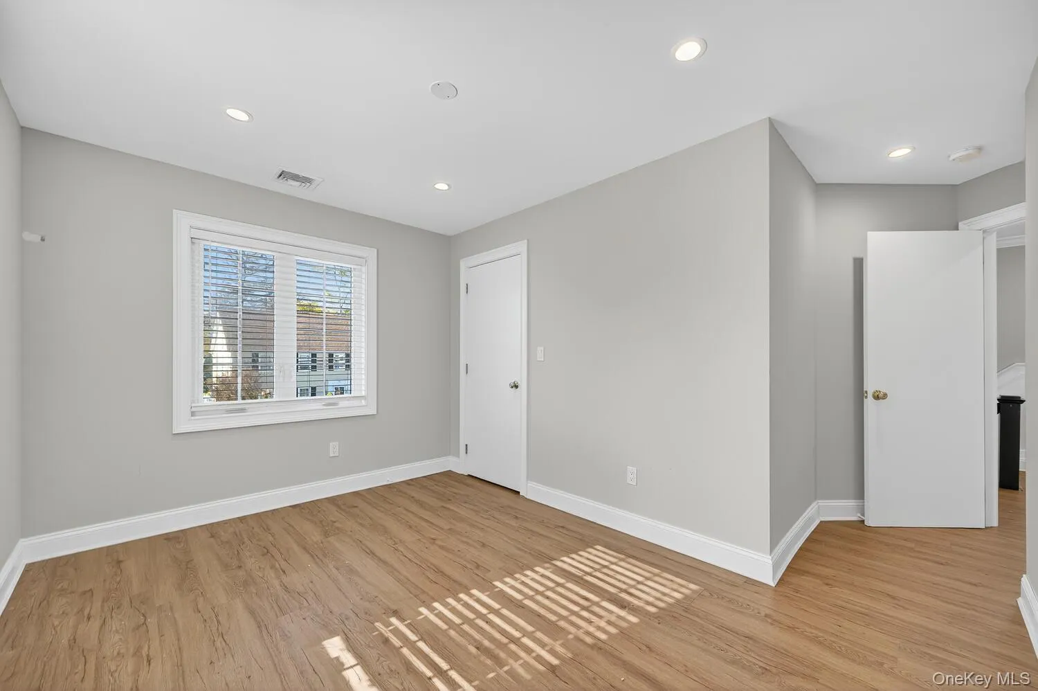 Unfurnished bedroom featuring light wood-type flooring and recessed lighting Unfurnished bedroom featuring light wood-type flooring and recessed lighting
