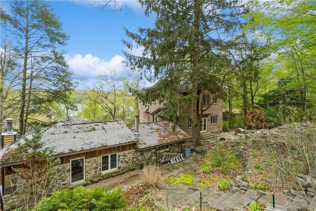 Patio and gardens behind the cottage. Lake views and sitting areas to be enjoyed. Patio and gardens behind the cottage. Lake views and sitting areas to be enjoyed.