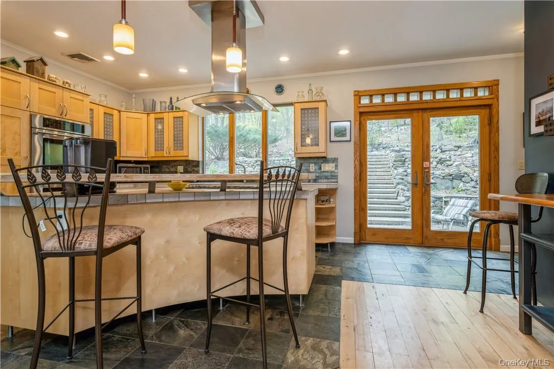 Views to the back feature stone walls, patio and stairway leading to large yard - perfect for garden or your future pool plans. Views to the back feature stone walls, patio and stairway leading to large yard - perfect for garden or your future pool plans.