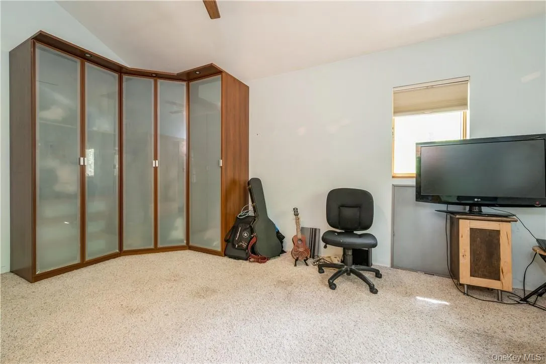 Double doors lead to this bedroom with high ceilings, space, and light. Double doors lead to this bedroom with high ceilings, space, and light.