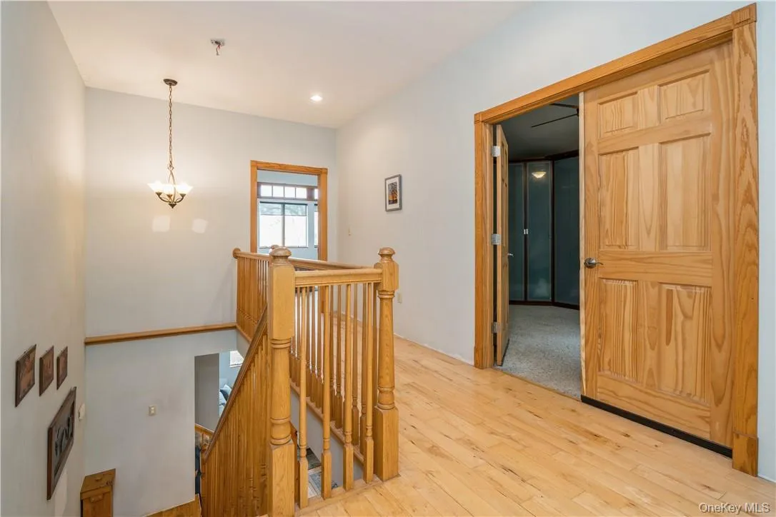 Stairs to second floor.Double doors lead to additional bedroom. Stairs to second floor.Double doors lead to additional bedroom.