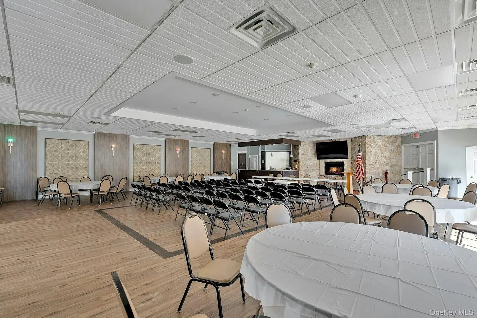 Dining area featuring a fireplace and light wood-type flooring Dining area featuring a fireplace and light wood-type flooring
