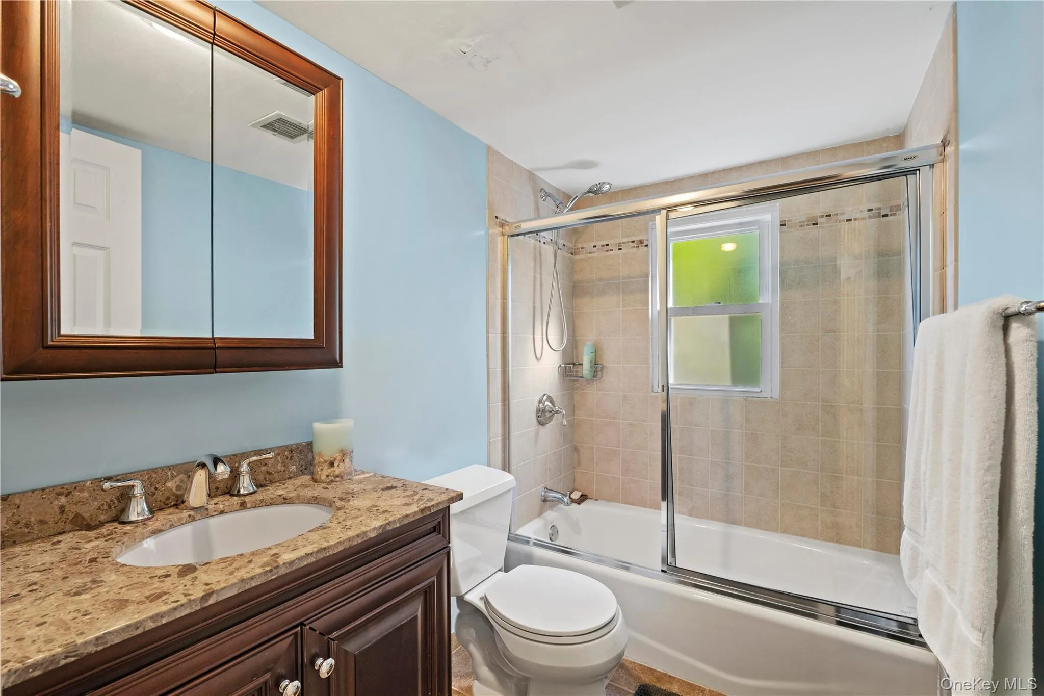 1 of 3 -Full bathroom featuring vanity and shower / bath combination with glass door 1 of 3 -Full bathroom featuring vanity and shower / bath combination with glass door