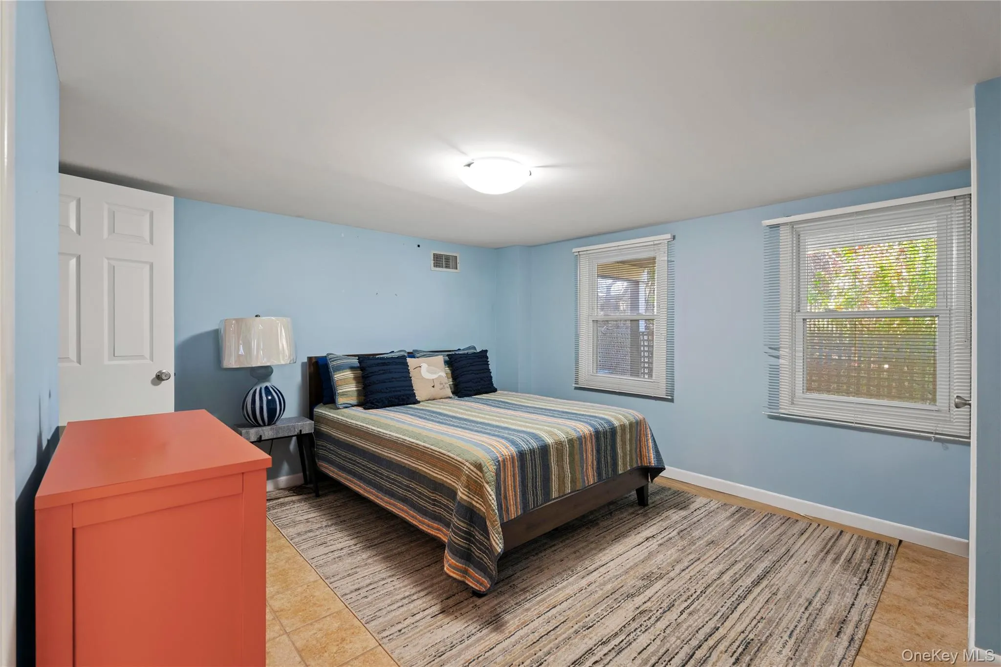 Bedroom1 of 4 with baseboards and light tile patterned flooring Bedroom1 of 4 with baseboards and light tile patterned flooring