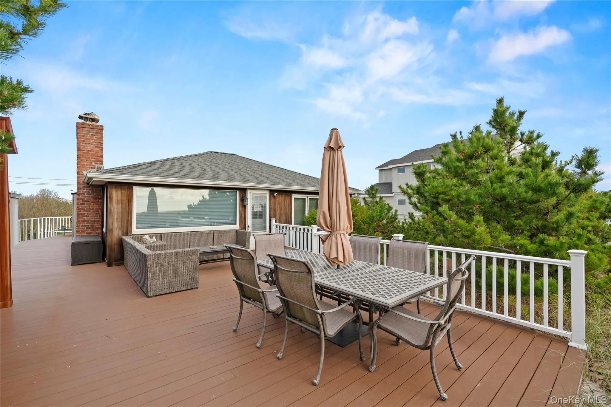 Deck featuring outdoor dining space and an outdoor living space Deck featuring outdoor dining space and an outdoor living space