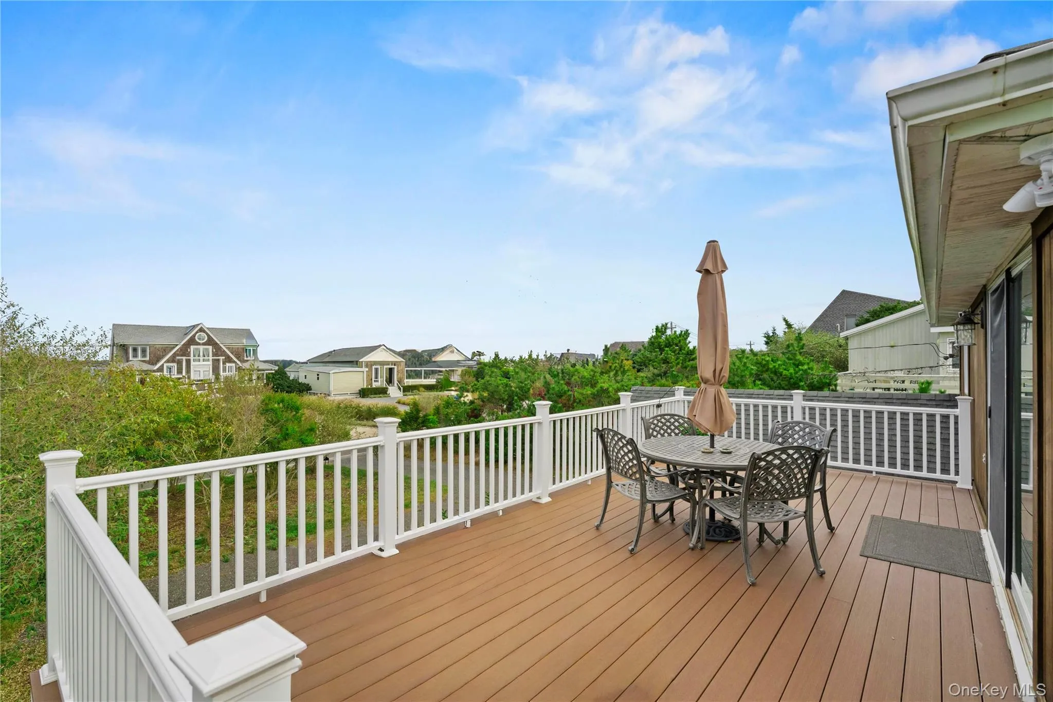 Front deck lounge with Dining / Bay views Front deck lounge with Dining / Bay views