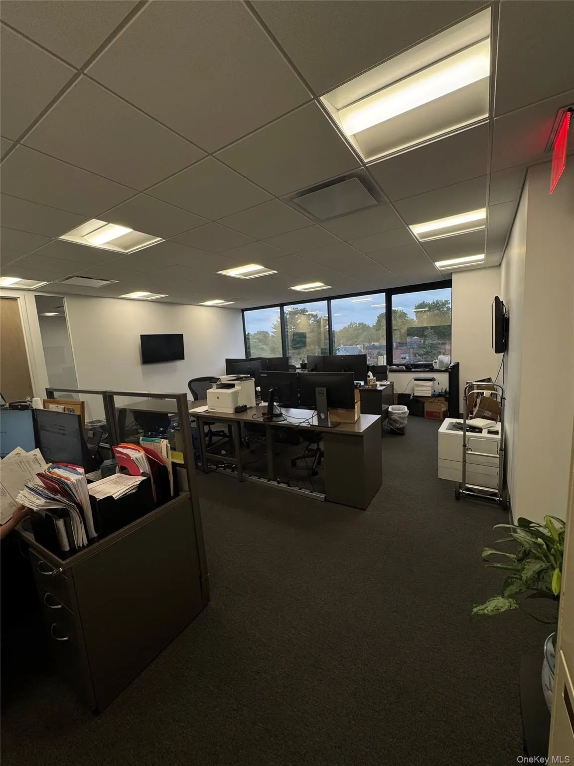 Office space with a paneled ceiling Office space with a paneled ceiling