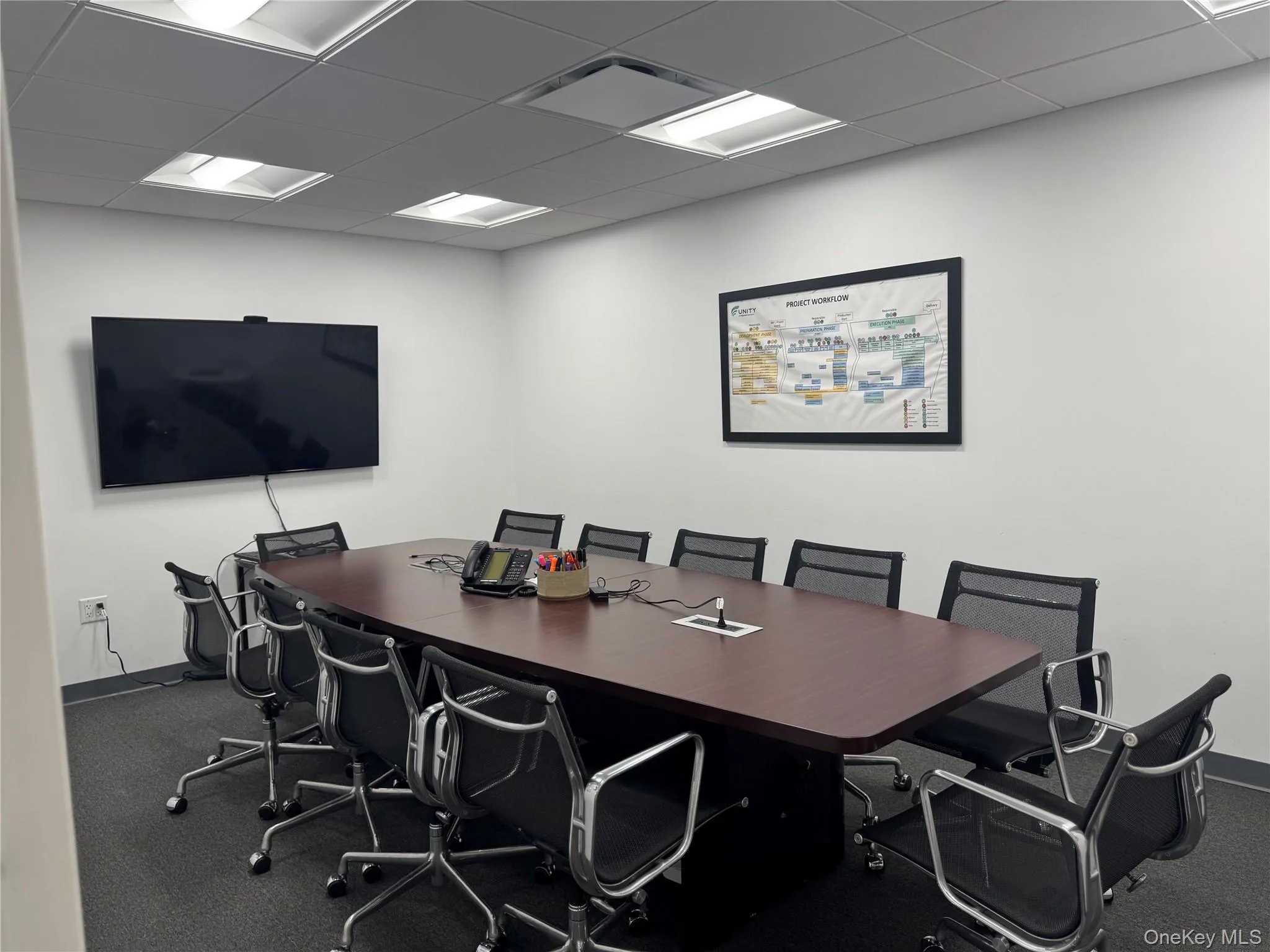 Office space with a paneled ceiling Office space with a paneled ceiling