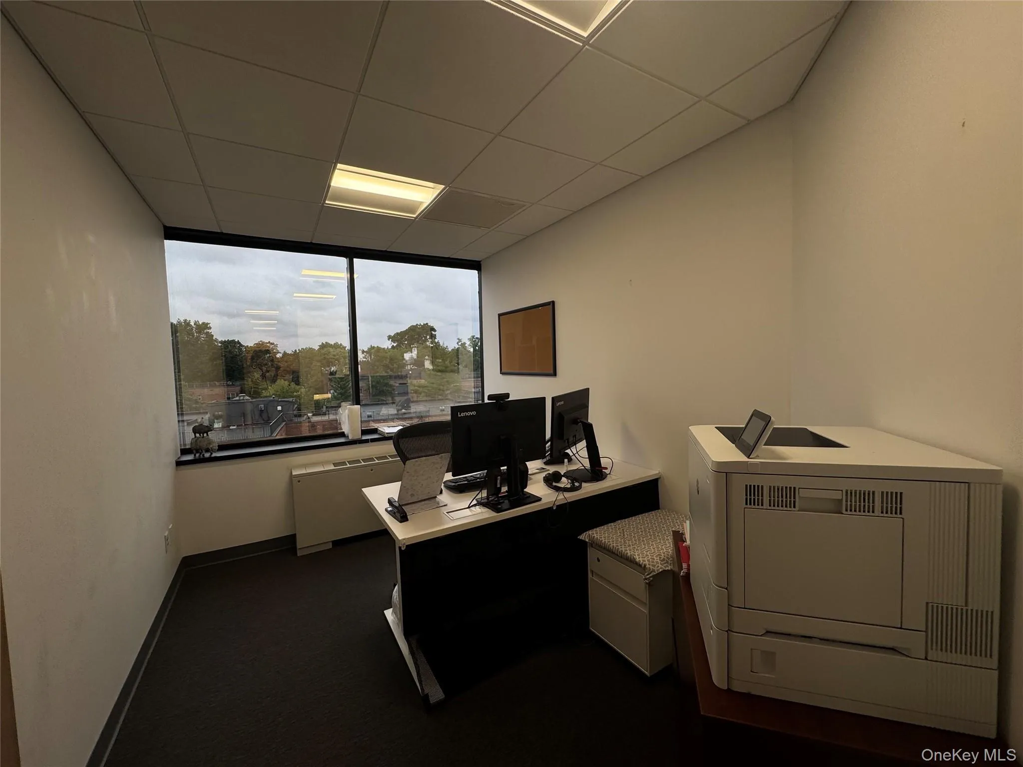 Office with a drop ceiling and heating unit Office with a drop ceiling and heating unit