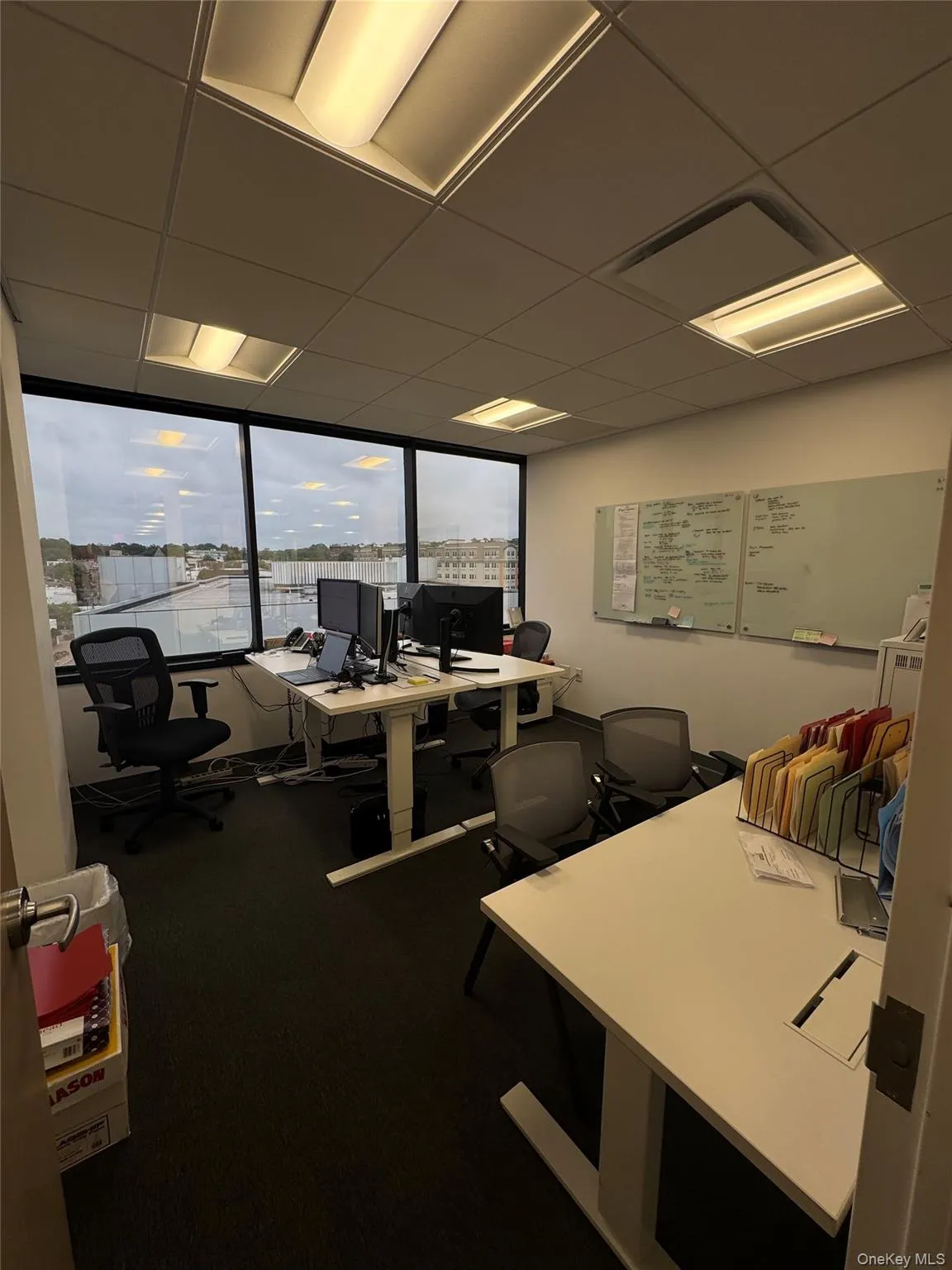 Office space with a paneled ceiling Office space with a paneled ceiling