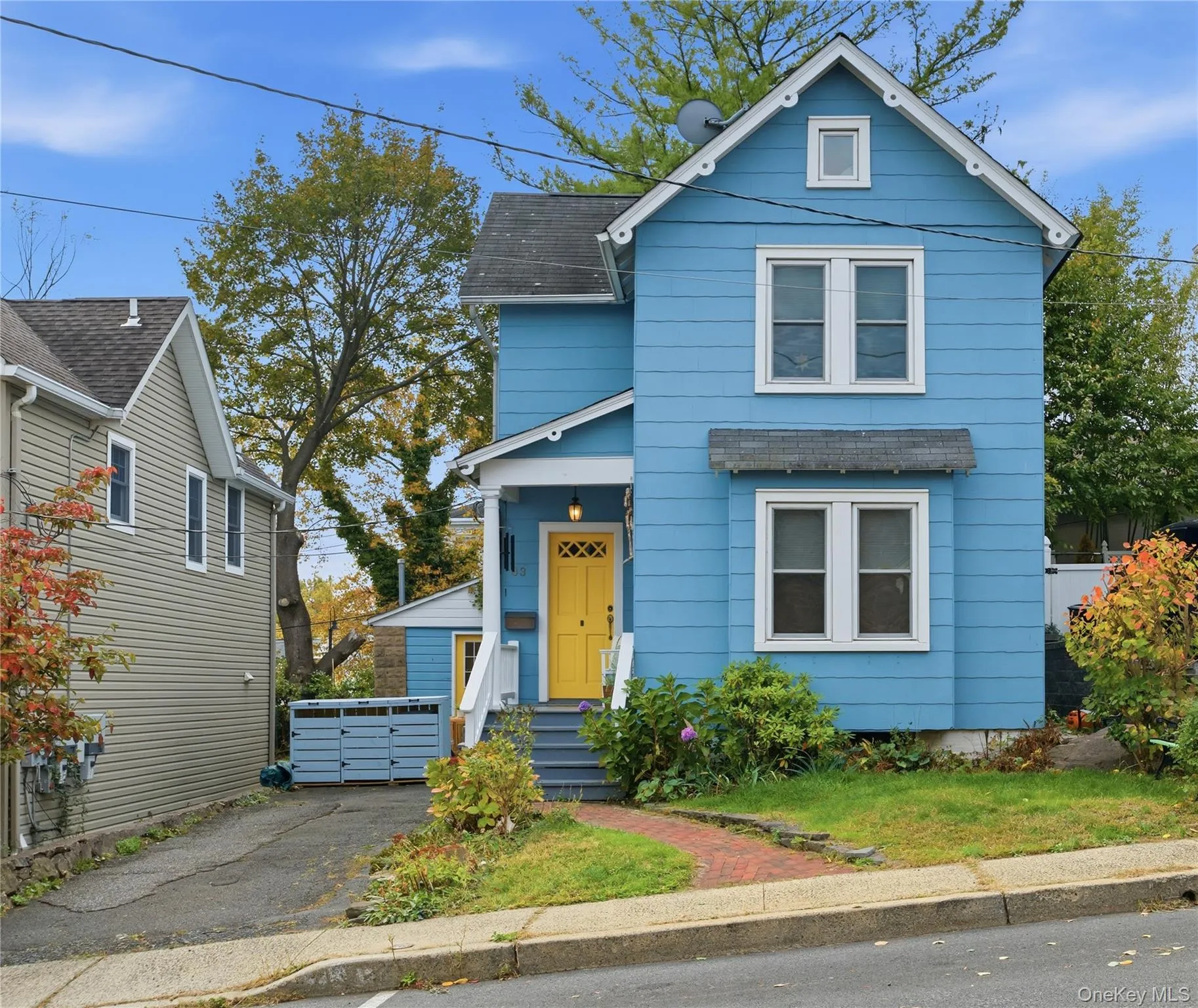 View of front facade featuring a shingled roof View of front facade featuring a shingled roof
