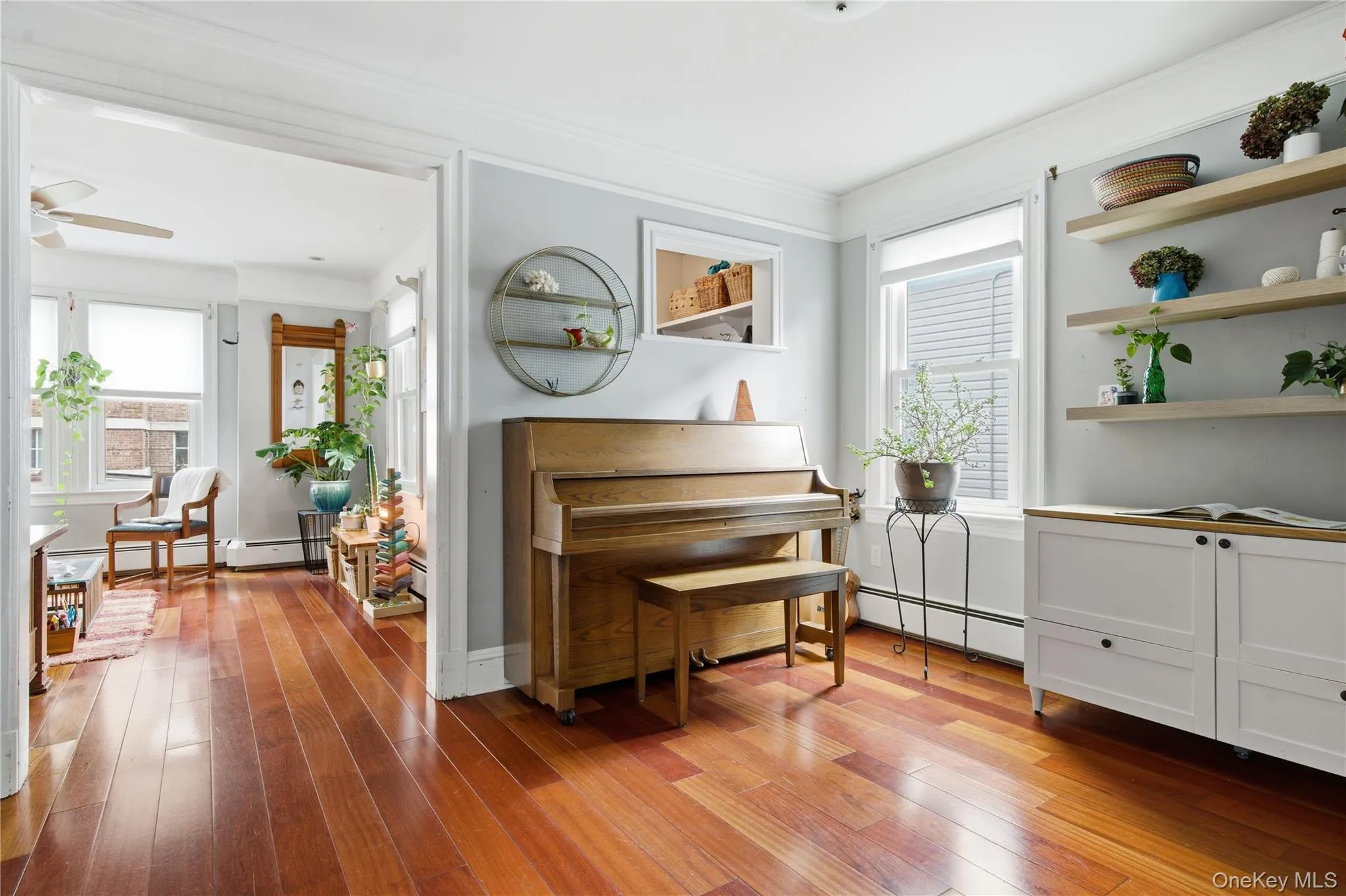 Sitting room featuring light wood-style floors and a baseboard radiator Sitting room featuring light wood-style floors and a baseboard radiator