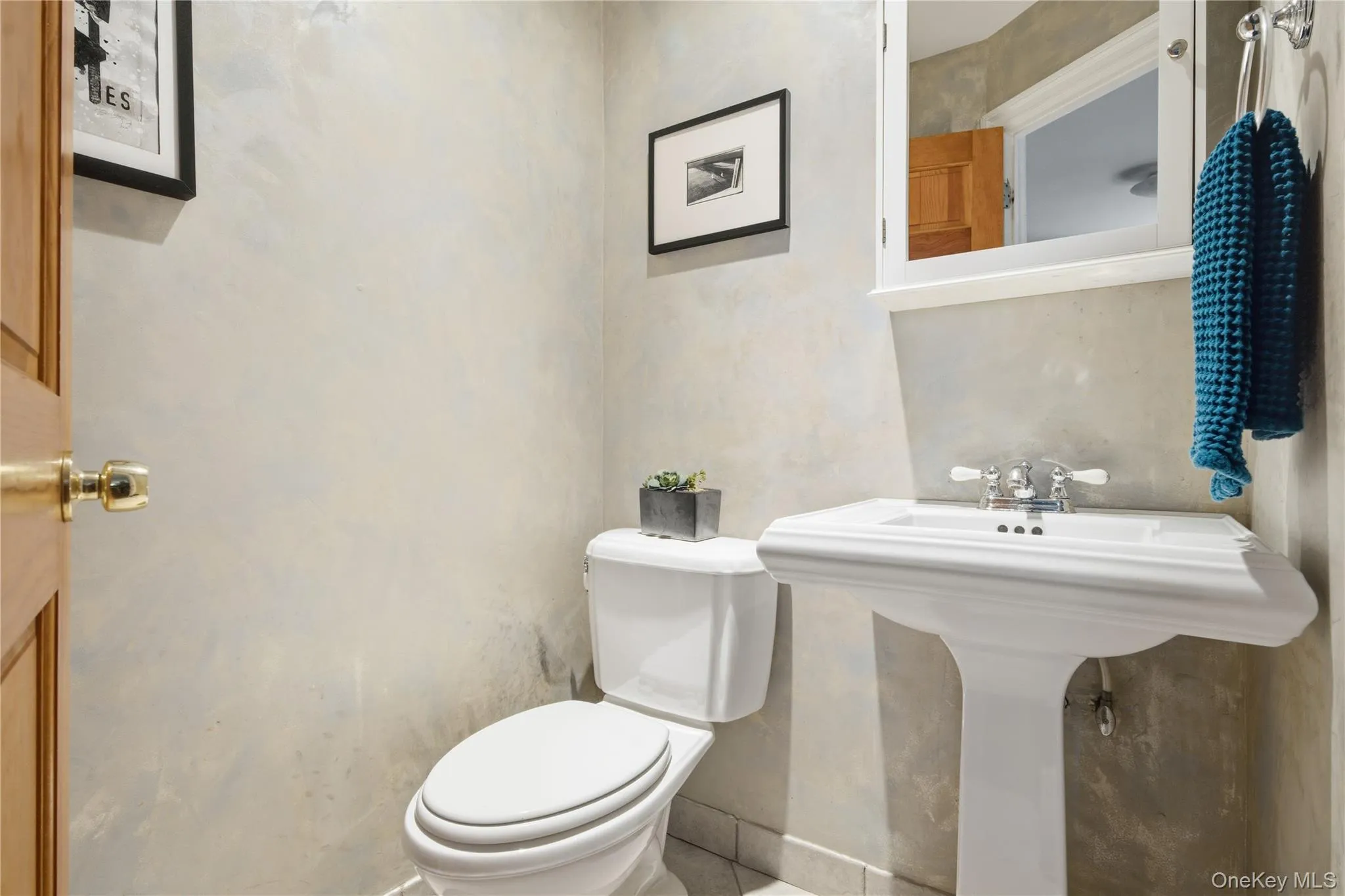 Bathroom featuring toilet and tile patterned floors Bathroom featuring toilet and tile patterned floors