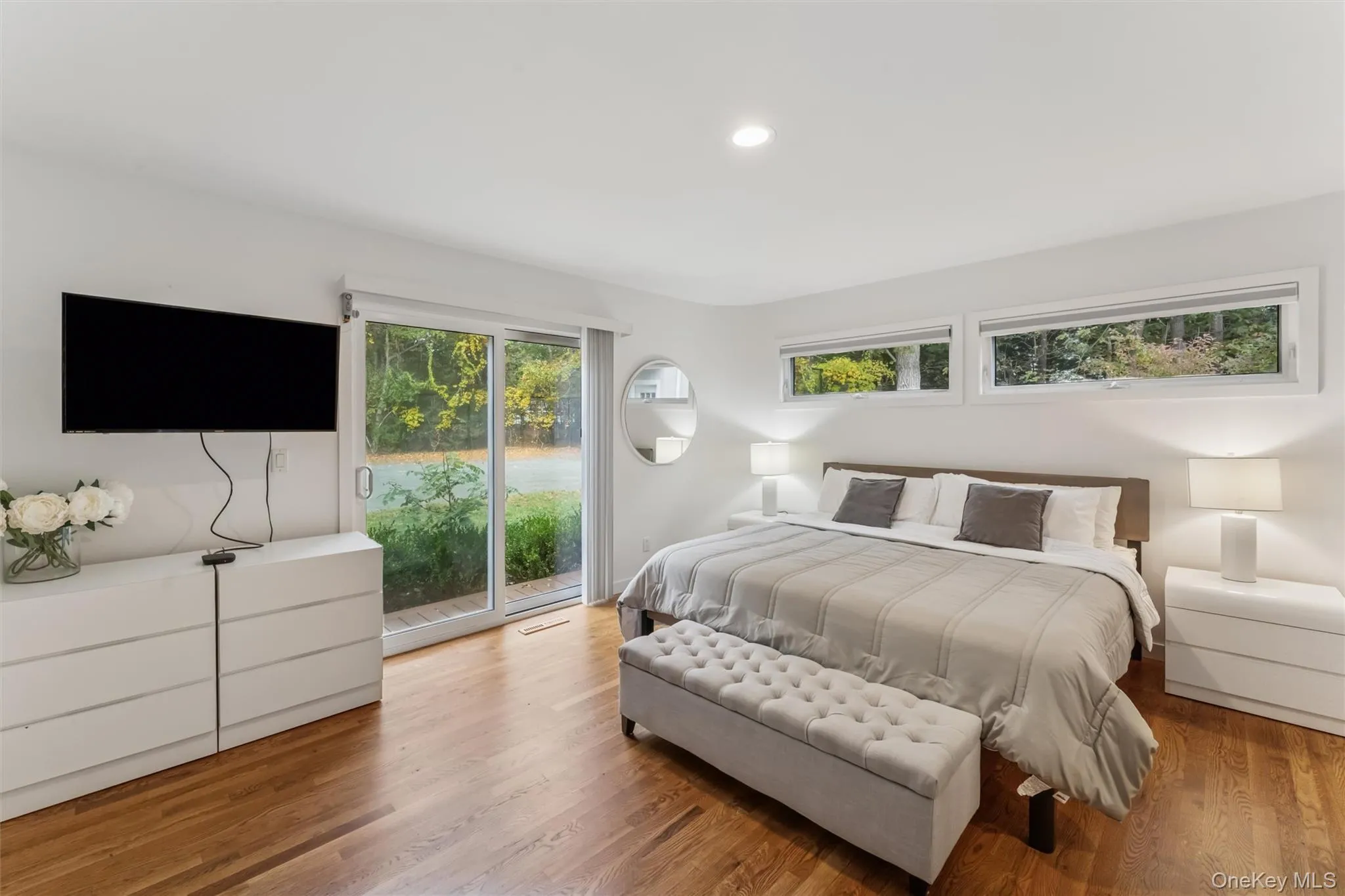 Bedroom with access to outside, wood finished floors, and recessed lighting Bedroom with access to outside, wood finished floors, and recessed lighting