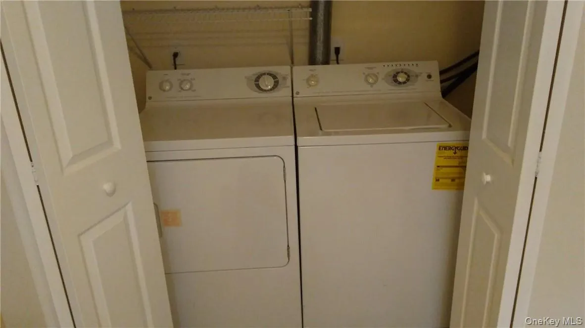 Clothes washing area with washing machine and dryer Clothes washing area with washing machine and dryer
