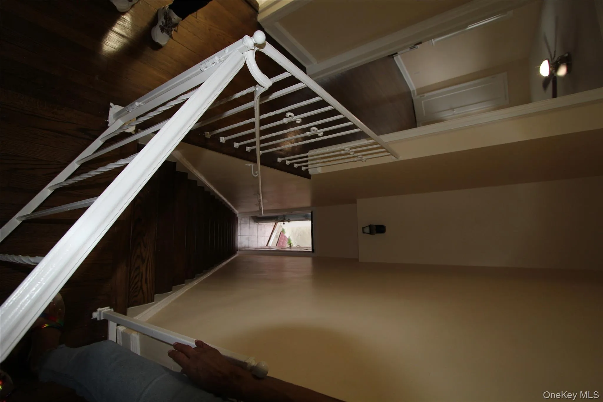 Stairs featuring baseboards and wood finished floors Stairs featuring baseboards and wood finished floors