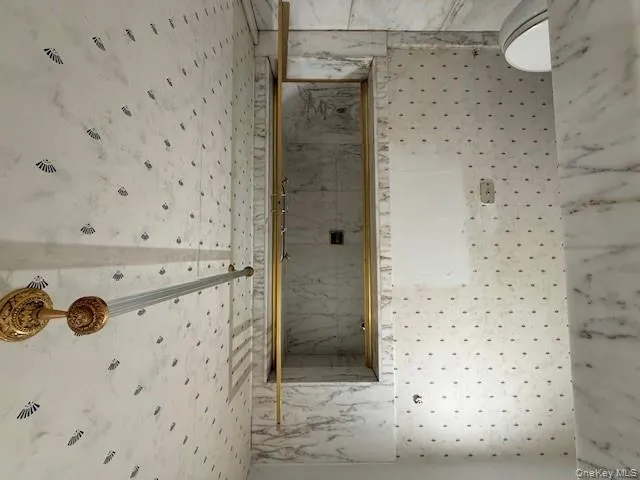 Full bathroom featuring toilet and a shower stall Full bathroom featuring toilet and a shower stall