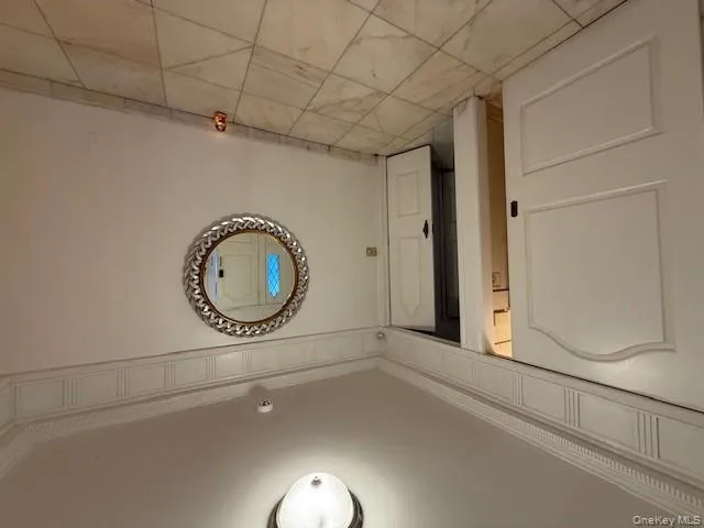 Unfurnished room with baseboards and ornamental molding Unfurnished room with baseboards and ornamental molding