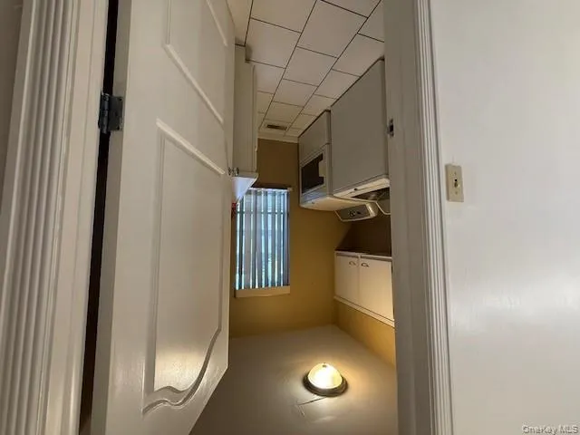 Laundry room featuring washer and clothes dryer, light tile patterned flooring, and cabinet space Laundry room featuring washer and clothes dryer, light tile patterned flooring, and cabinet space