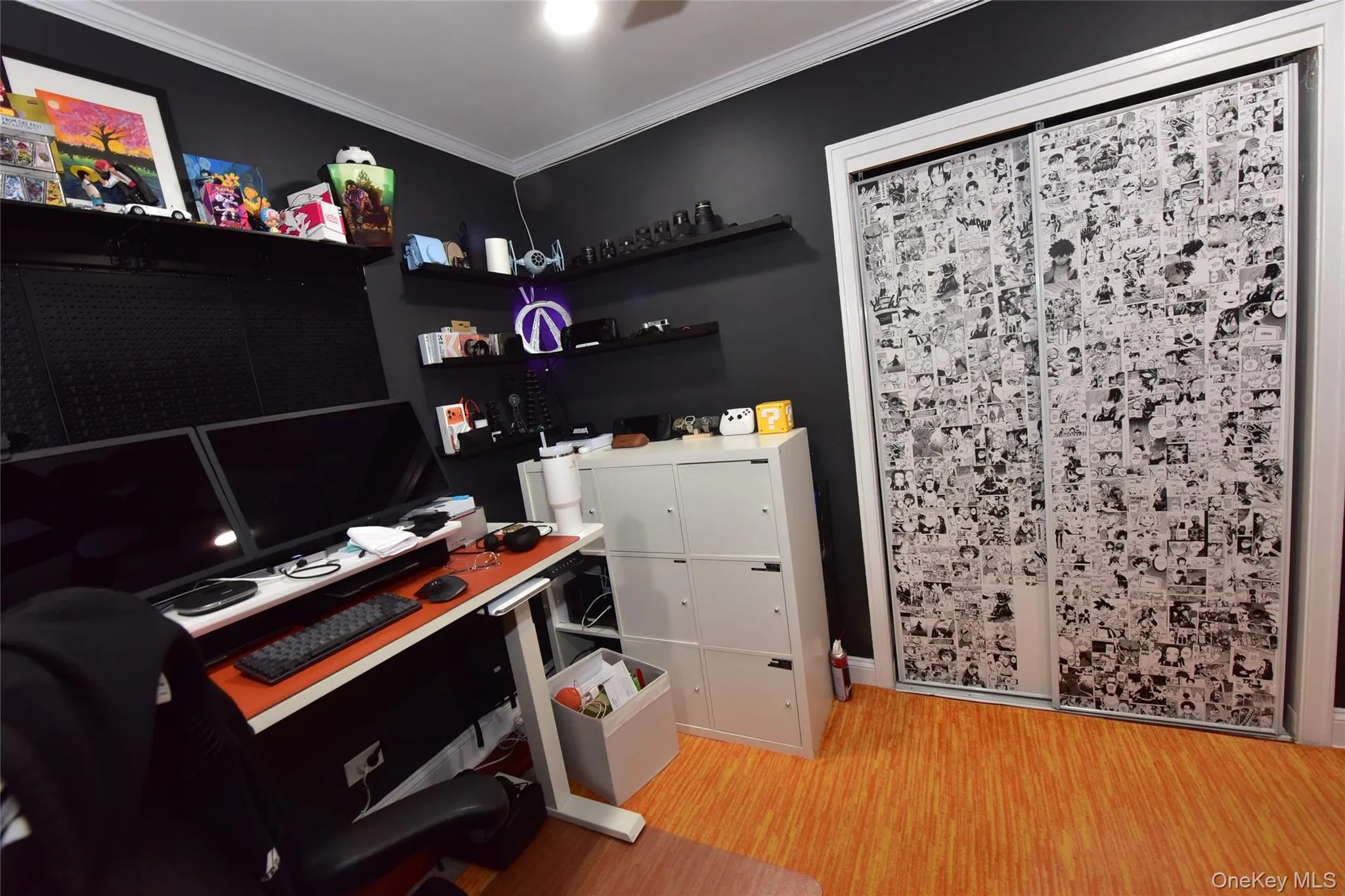 Home office featuring light wood finished floors and ornamental molding Home office featuring light wood finished floors and ornamental molding