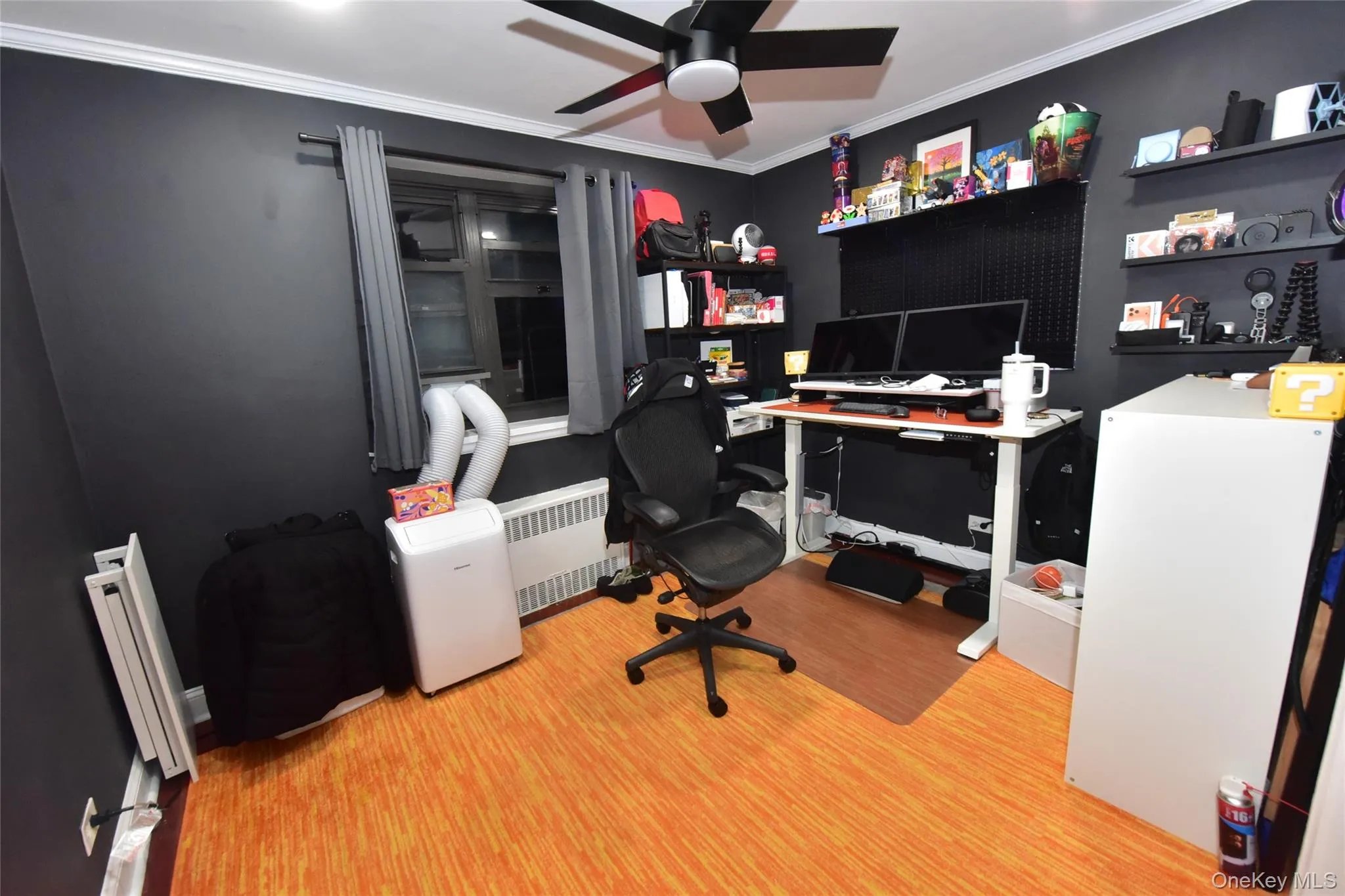 Office area with ornamental molding, light wood-style flooring, radiator heating unit, and ceiling fan Office area with ornamental molding, light wood-style flooring, radiator heating unit, and ceiling fan
