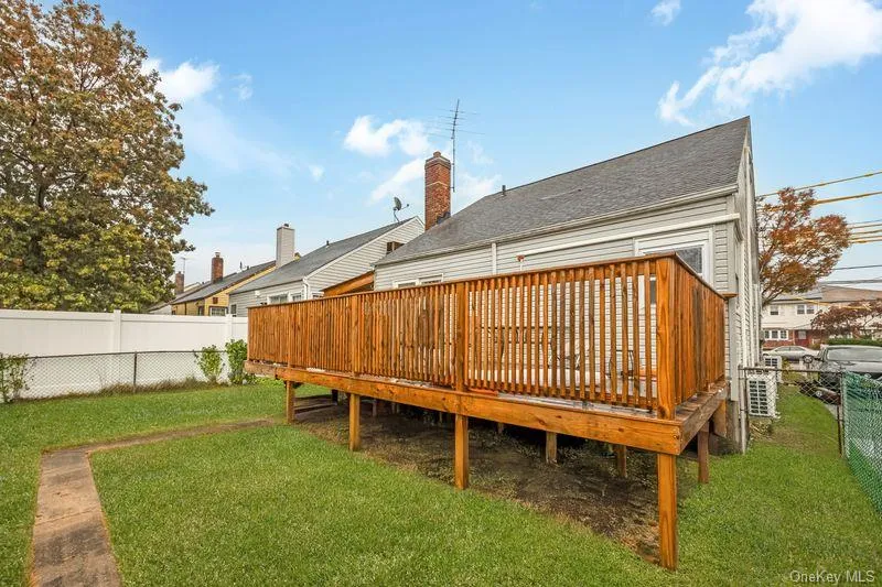 Rear view of house featuring a fenced backyard Rear view of house featuring a fenced backyard
