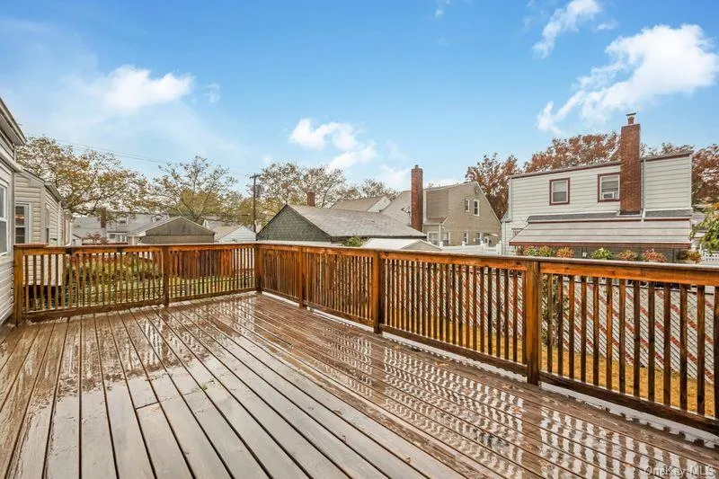 Wooden terrace featuring a residential view Wooden terrace featuring a residential view
