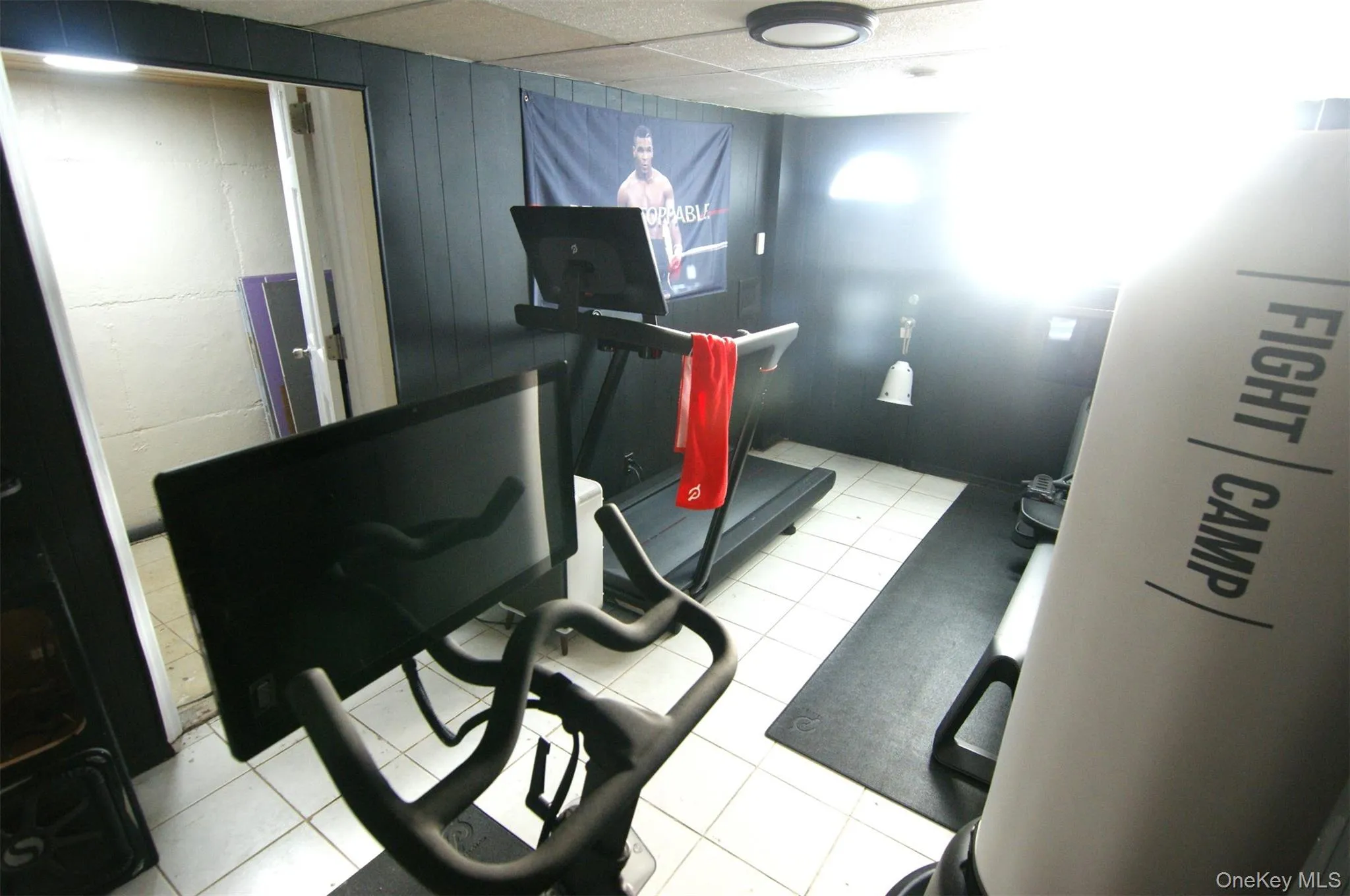 Exercise room featuring a drop ceiling Exercise room featuring a drop ceiling