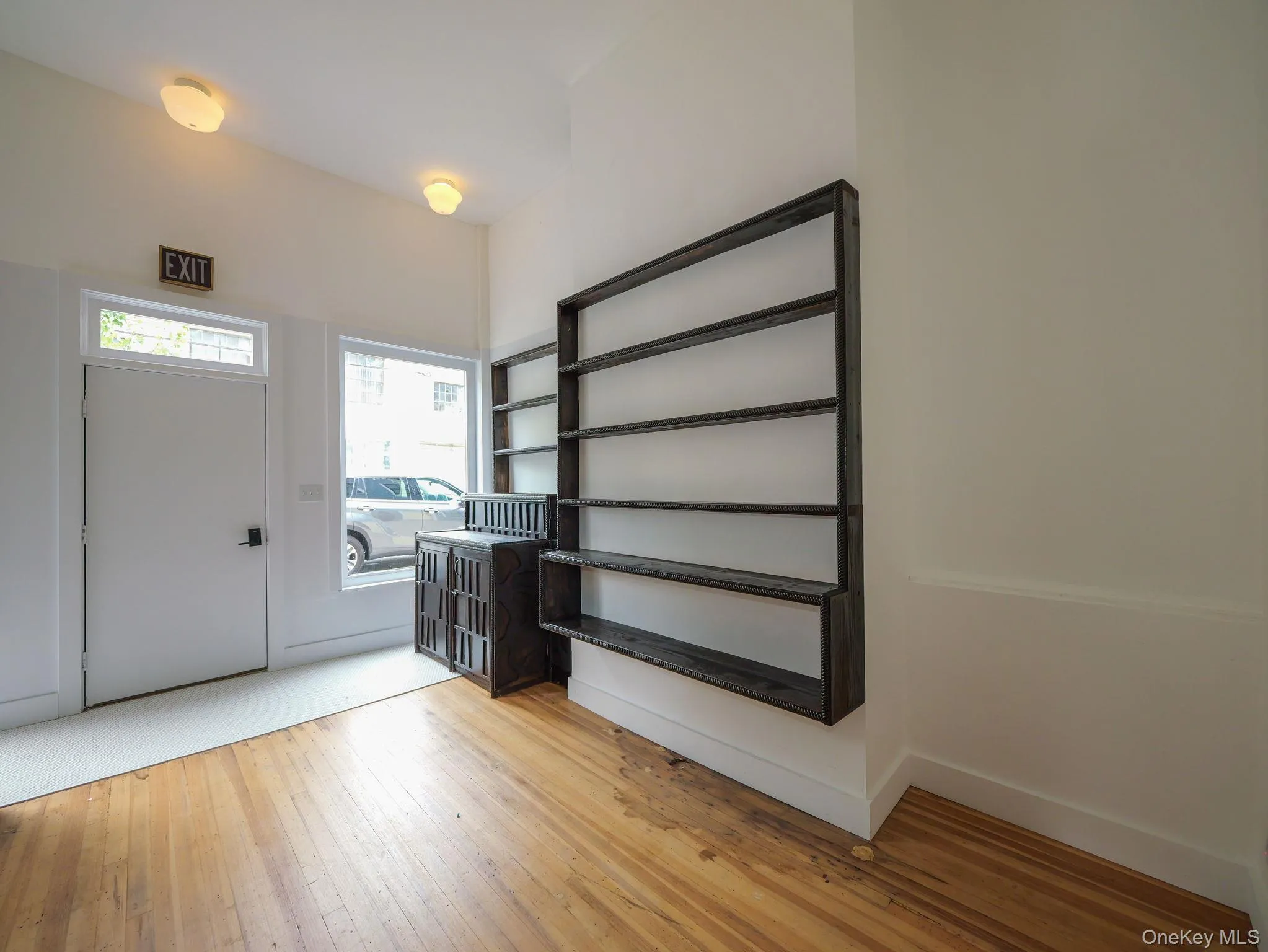 Foyer with light wood-style flooring and baseboards Foyer with light wood-style flooring and baseboards
