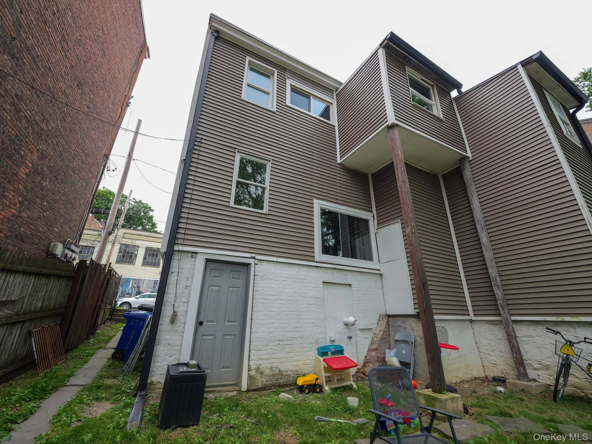 Rear view of house with brick siding Rear view of house with brick siding