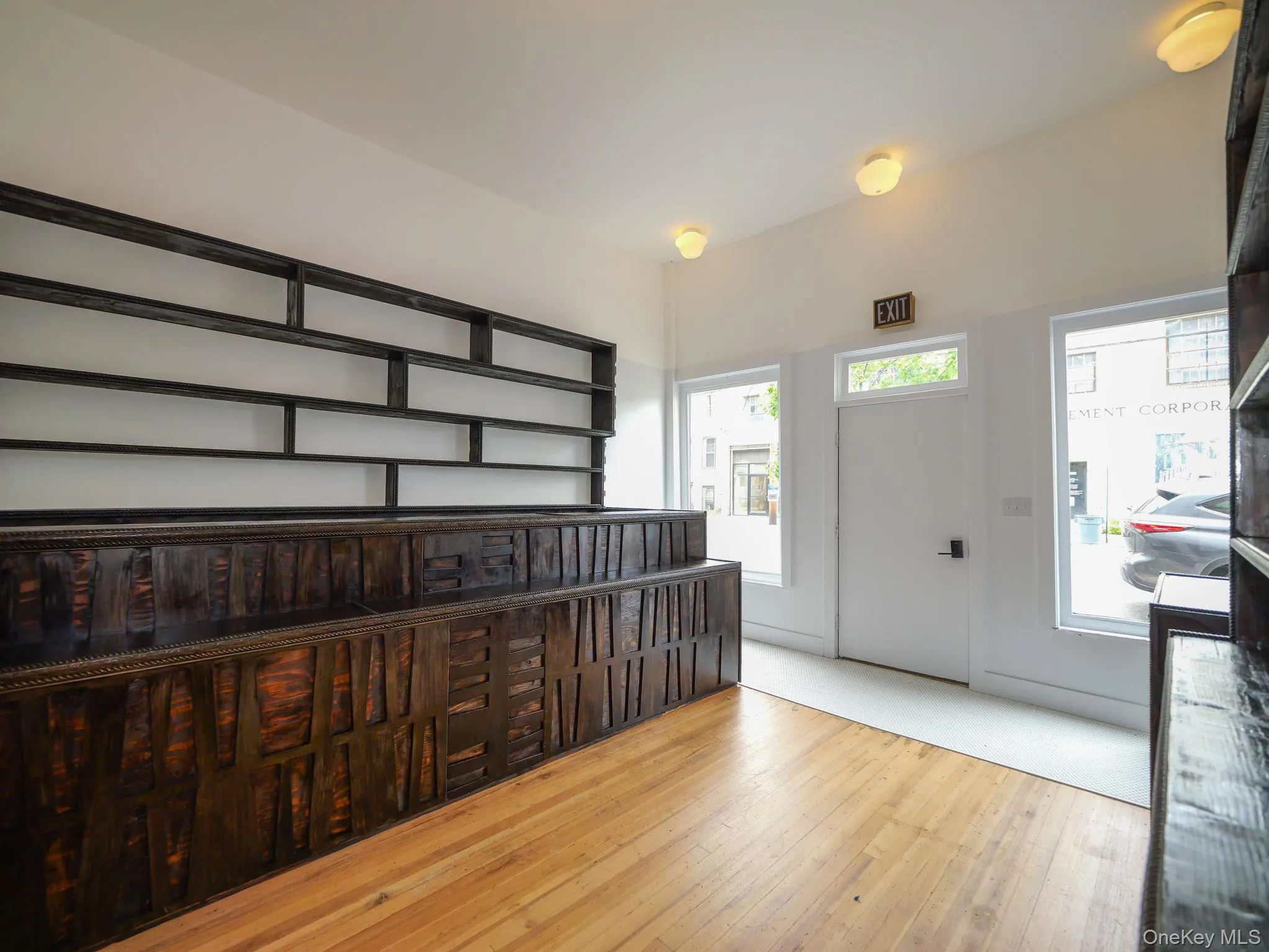 Entrance foyer featuring hardwood / wood-style flooring Entrance foyer featuring hardwood / wood-style flooring