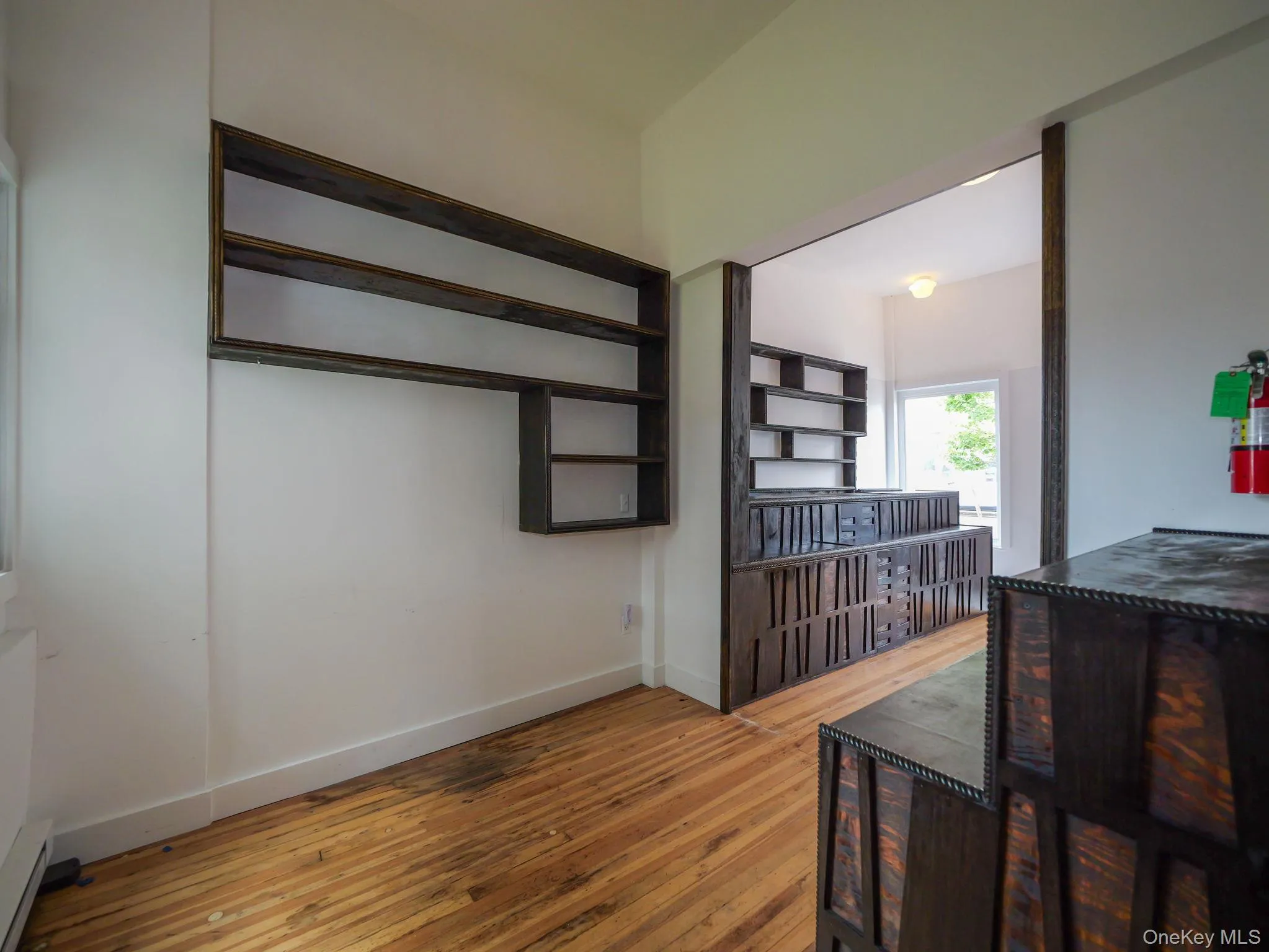 Dining room featuring light wood finished floors and a baseboard radiator Dining room featuring light wood finished floors and a baseboard radiator