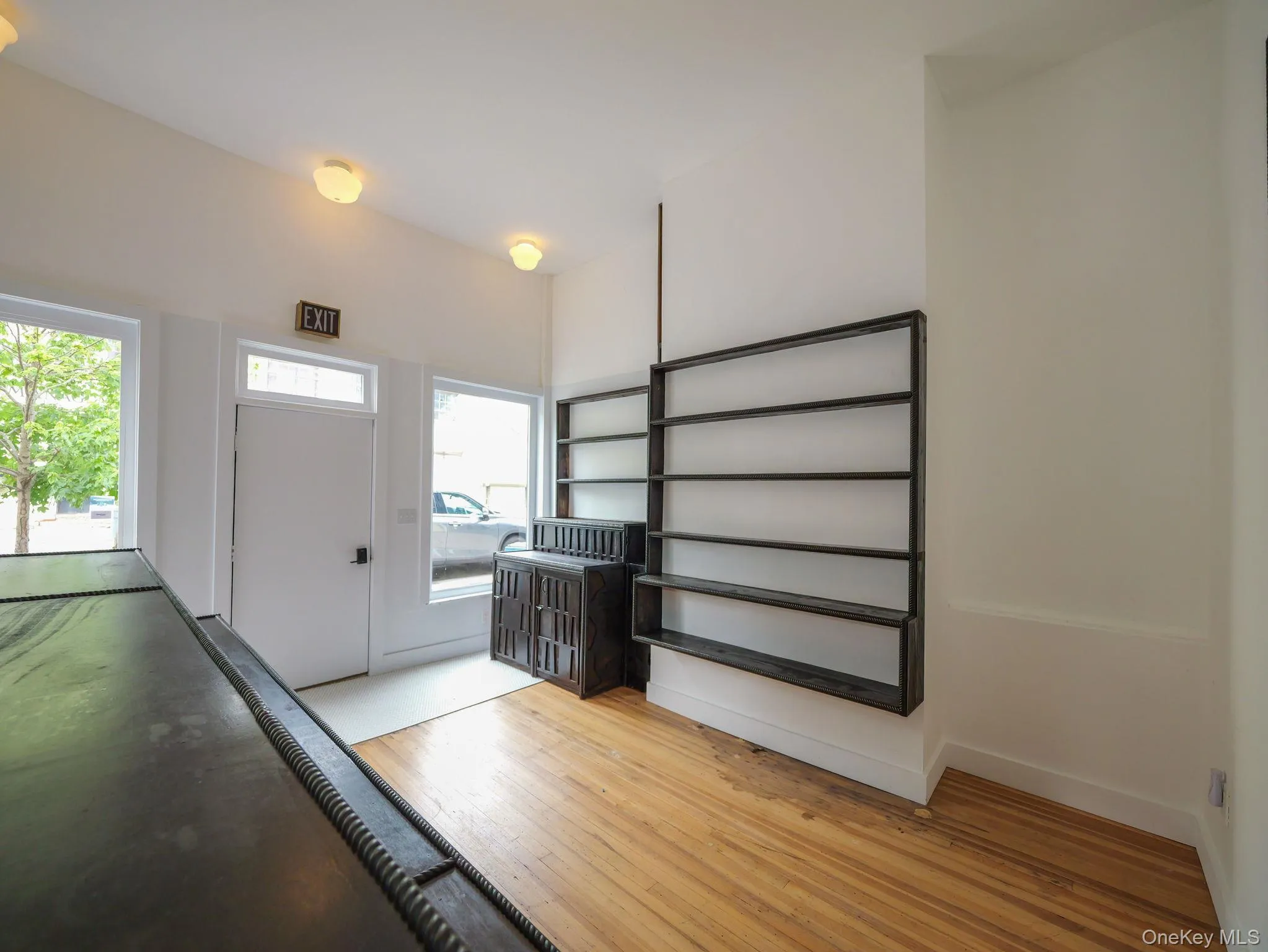 Foyer entrance featuring light wood finished floors and baseboards Foyer entrance featuring light wood finished floors and baseboards