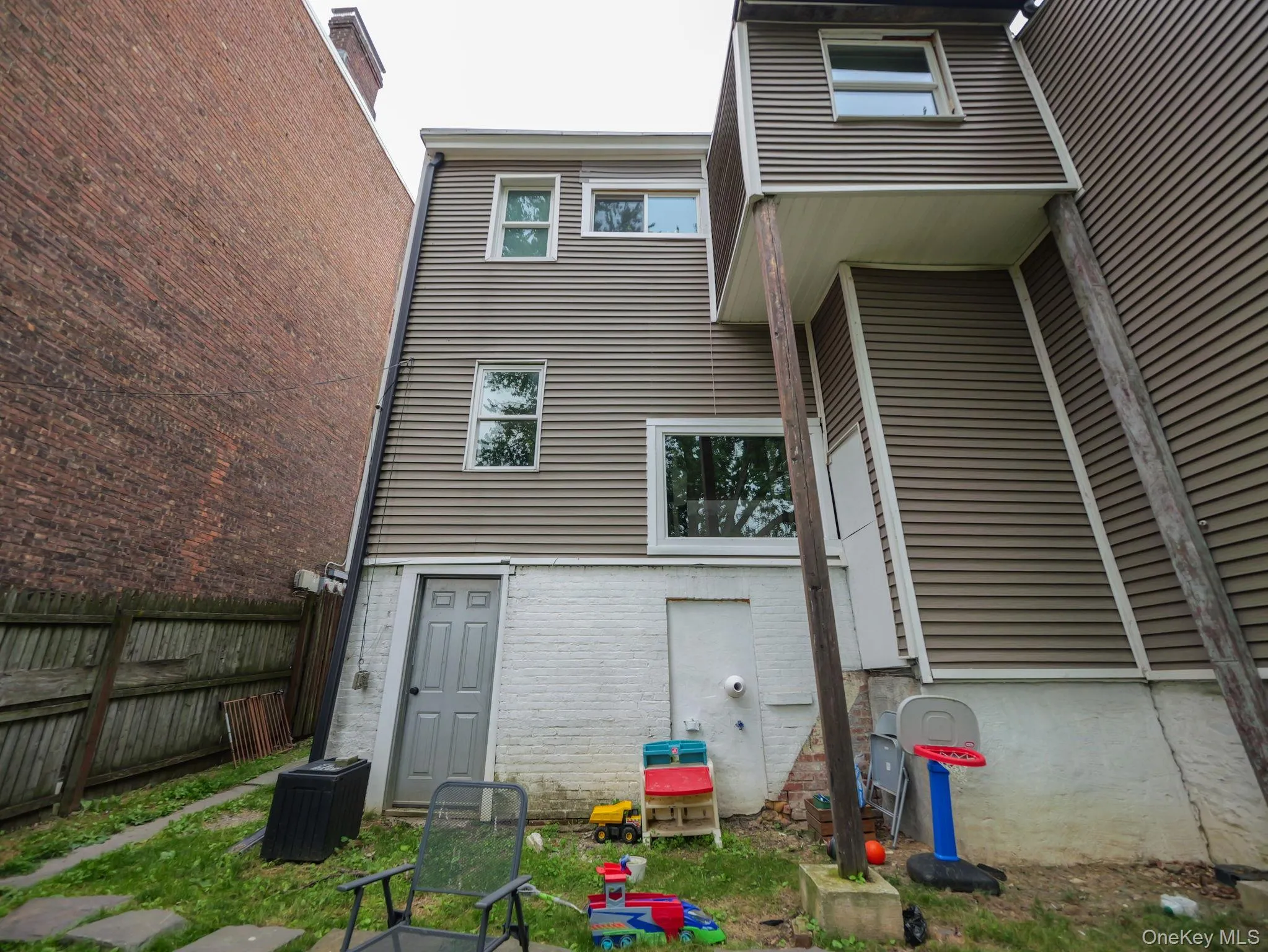 Rear view of house with brick siding Rear view of house with brick siding