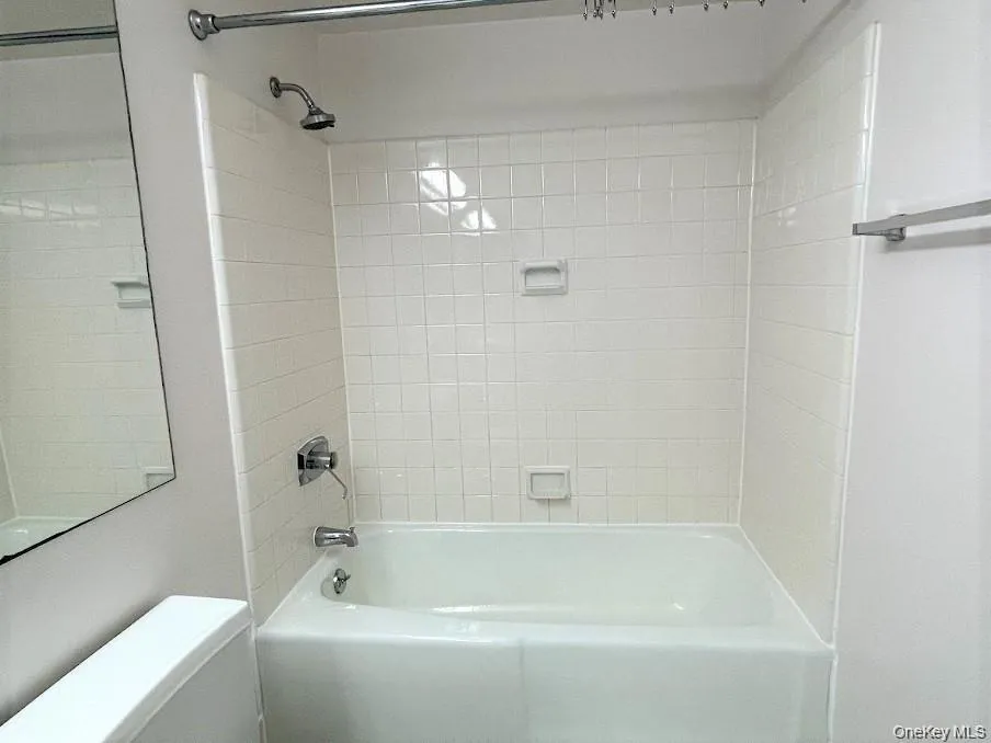 Bathroom with shower / tub combination and toilet Bathroom with shower / tub combination and toilet