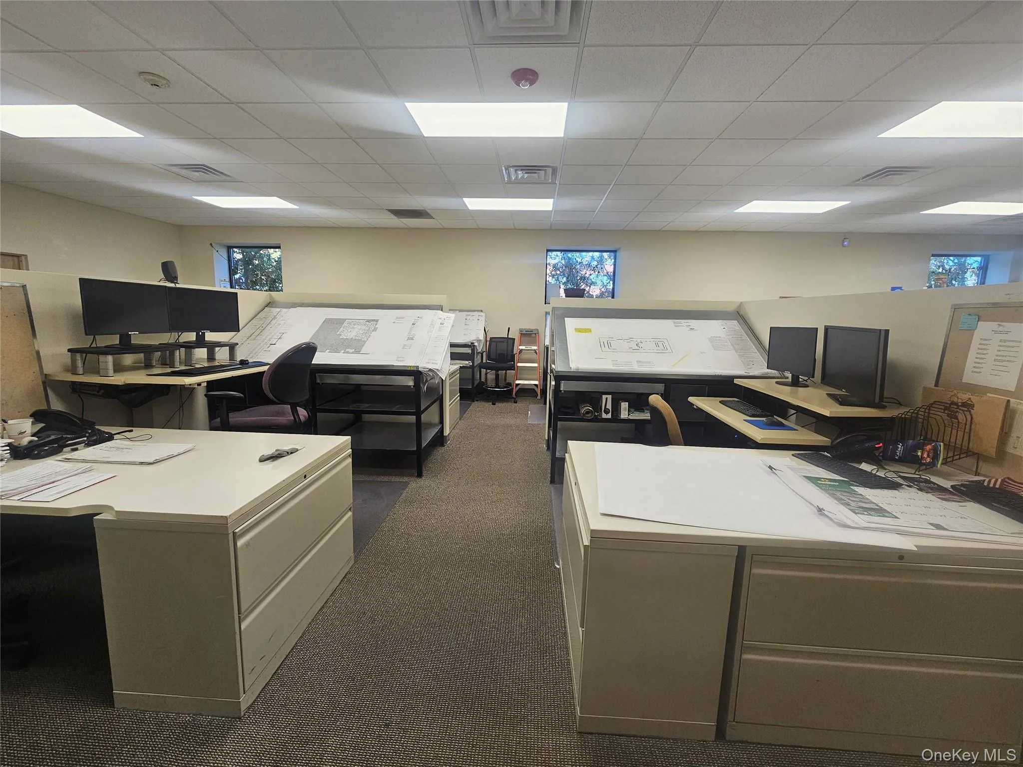 Office featuring a drop ceiling Office featuring a drop ceiling