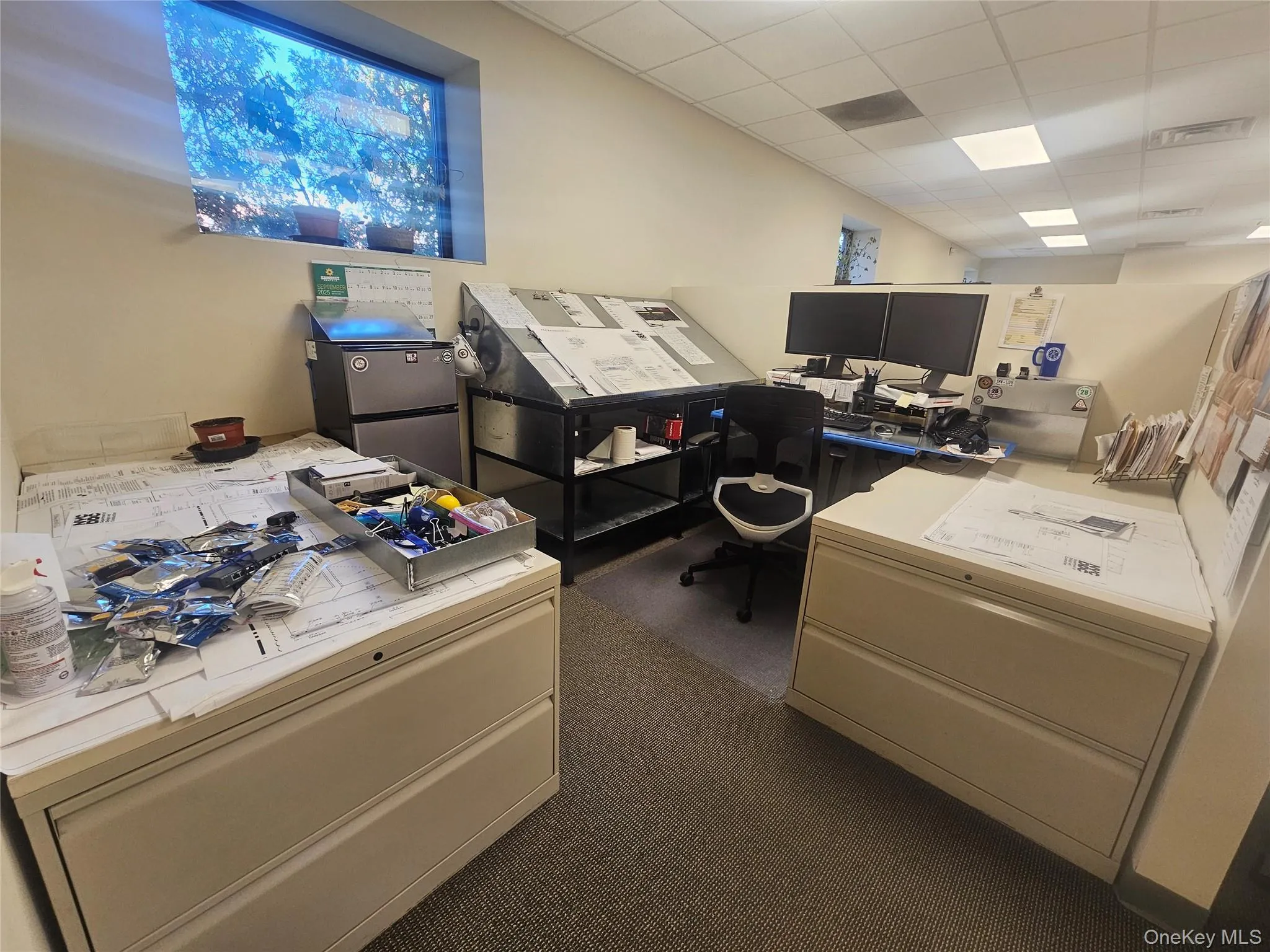 Office space with a drop ceiling Office space with a drop ceiling