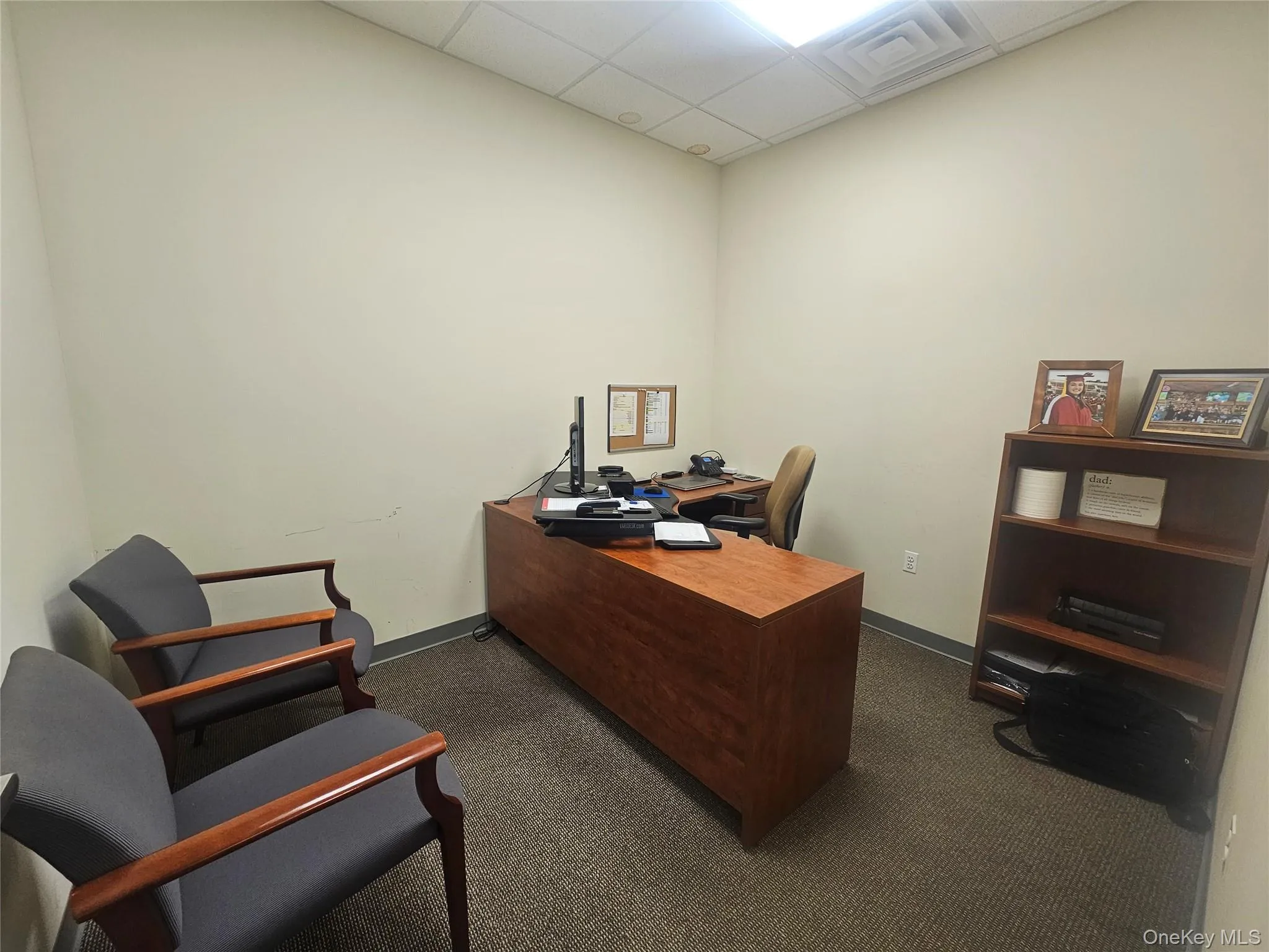 Home office featuring a drop ceiling Home office featuring a drop ceiling