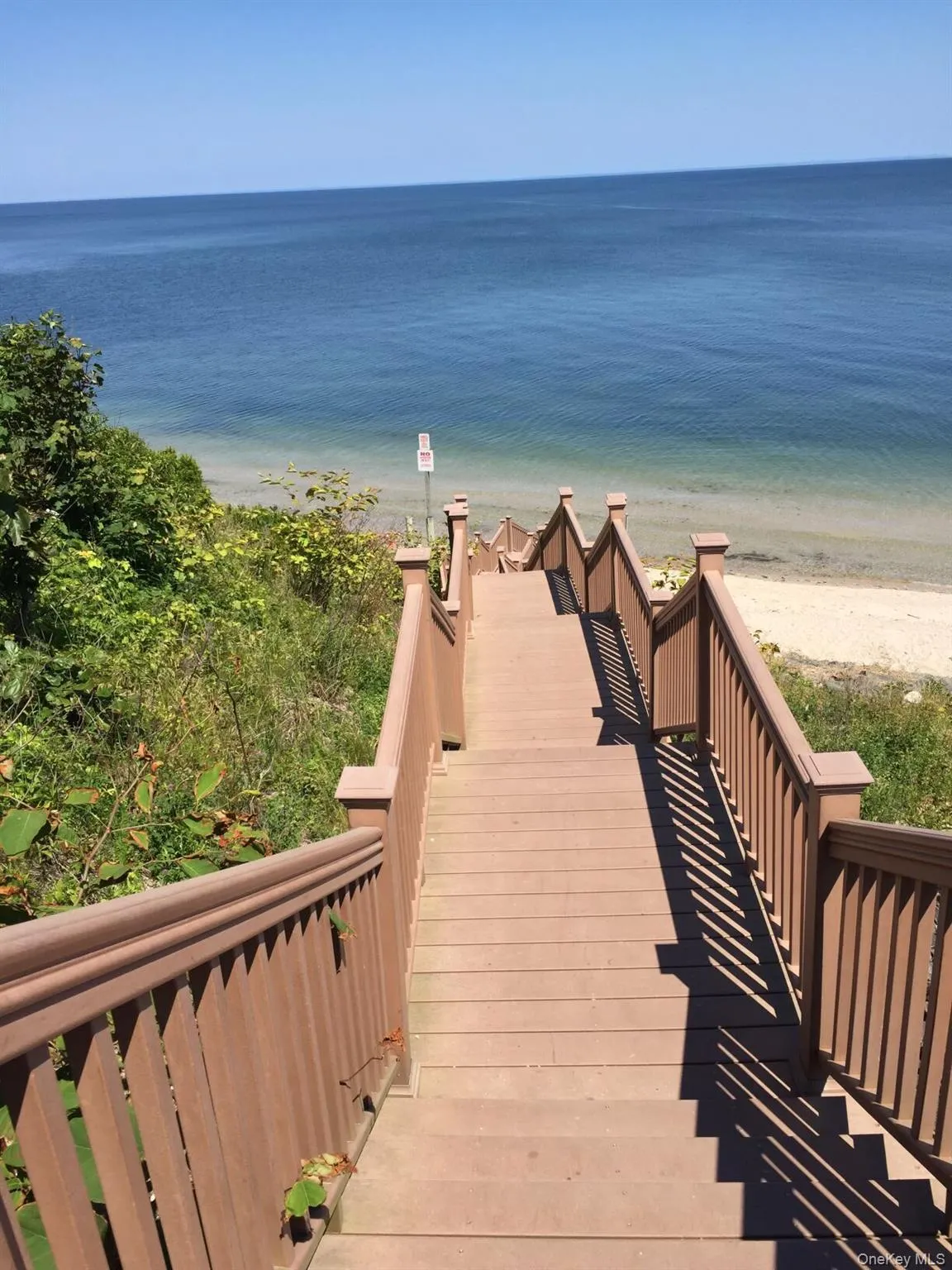 Surrounding community with view of water and beach Surrounding community with view of water and beach