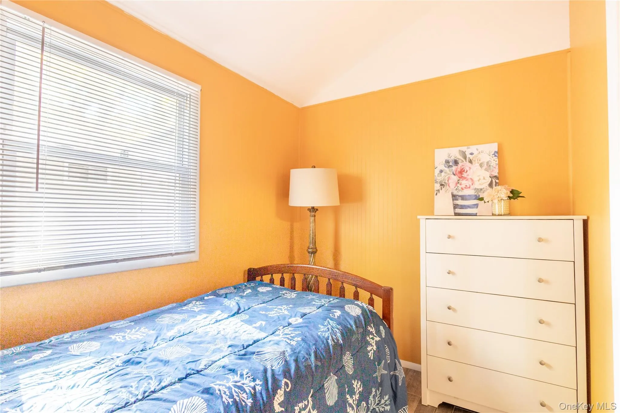 Bedroom with lofted ceiling Bedroom with lofted ceiling