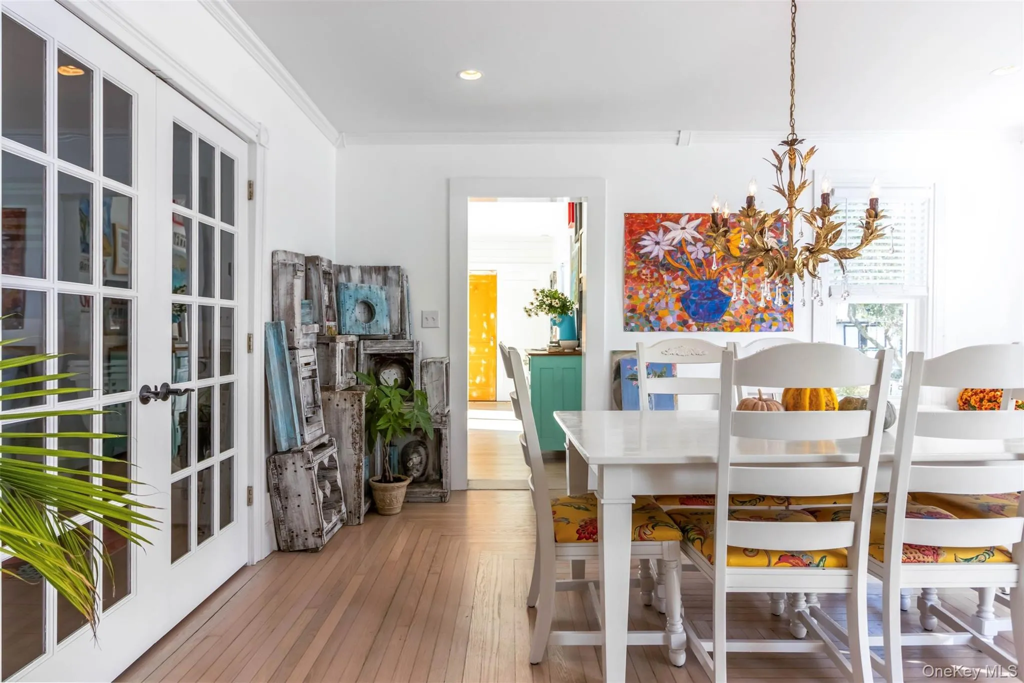 Dining area featuring crown molding, light wood-type flooring, a chandelier, and recessed lighting Dining area featuring crown molding, light wood-type flooring, a chandelier, and recessed lighting