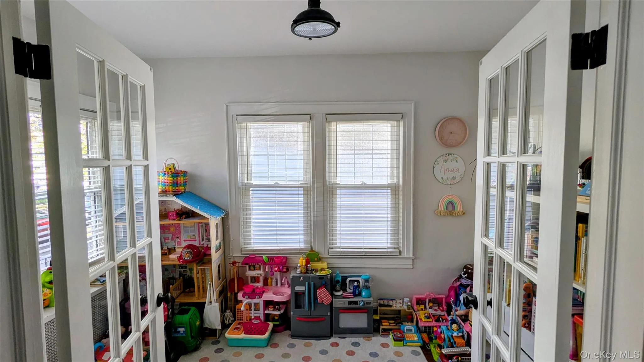 Kids rec room or office featuring french doors Kids rec room or office featuring french doors