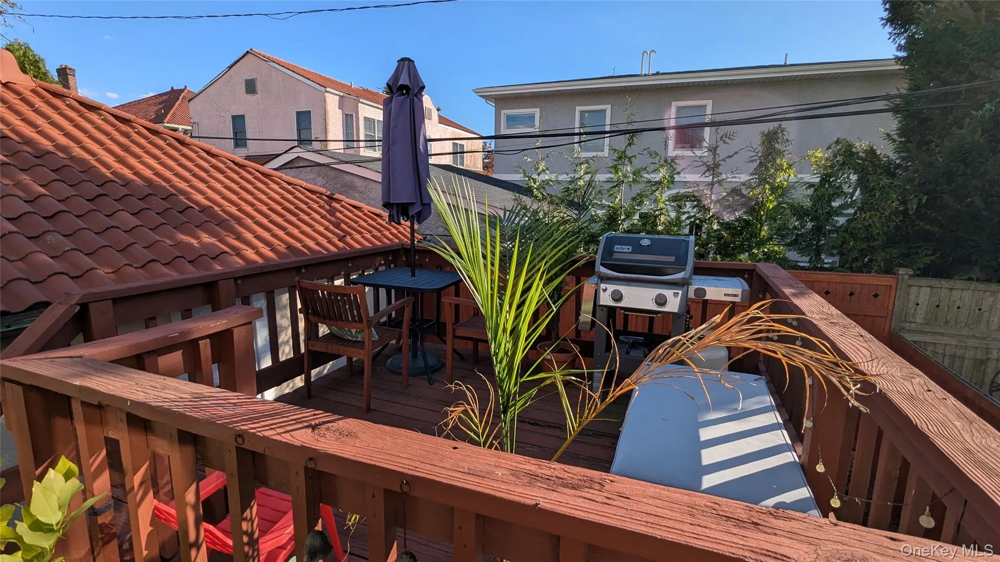 Wooden deck in back of house Wooden deck in back of house