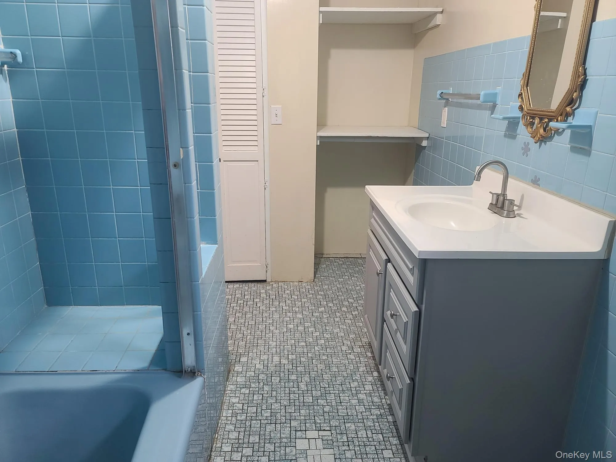 Full bathroom with extra large closet with a window Full bathroom with extra large closet with a window